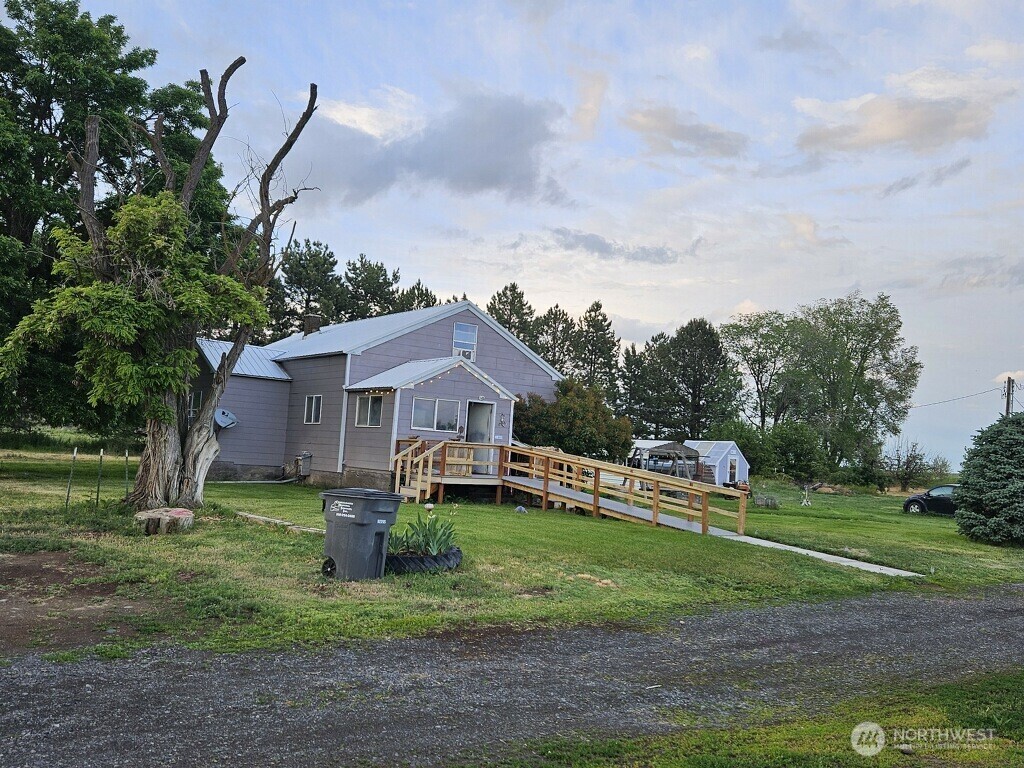 Charming farm on 20.07 acres with 19 irrigable acres, QCBID water rights.  3 bedroom, 1 bath farm house built in 1915.  1440 square foot shop with office area and lean to off the side for equipment storage.  450 square foot small animal barn.  Front pasture is fenced and cross fenced with hot wire.  Former riding arena.  Greenhouse and chicken coop.  RV electrical hookup. Handlines and wheel lines.  Garden area, fruit trees.  Second homesite that was previously a single wide that has since been moved, 5th wheel there now.