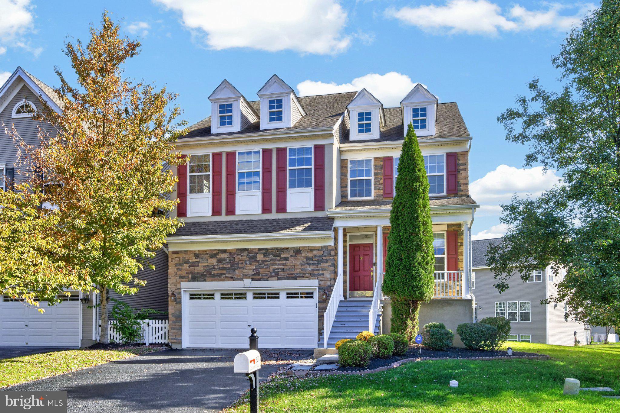 Welcome to 320 Dartmouth Road, a spacious and beautifully updated 5-bedroom, 3 full and 2 half bath carriage-style twin home offering 3,879 square feet of finished living space, including the finished lower level, in the highly desirable Byers Station community and Downingtown East School District. Featuring a dramatic two-story living room, beautiful hardwood floors, an open and inviting floor plan, a spacious primary suite, and an impressive finished basement, this home offers a wonderful combination of space, comfort, and versatility in one of Chester Springs' most sought-after communities.Step inside to a welcoming foyer and immediately appreciate the soaring ceilings and abundance of natural light that define the main level. The impressive two-story living room features a dramatic wall of windows, creating a bright and airy atmosphere that extends throughout the home. Beautiful hardwood flooring, updated lighting fixtures, and a neutral color palette complement the open design. The adjoining dining room offers an elegant space for entertaining, complete with a stylish statement chandelier and easy access to the kitchen.The spacious kitchen features granite countertops, a decorative tile backsplash, stainless steel appliances, gas cooking, recessed lighting, and a peninsula. Open to the inviting family room, the layout is ideal for both everyday living and entertaining. The family room is highlighted by a stunning floor-to-ceiling stone-look fireplace surround, flanked by custom floating shelves that add both character and functionality. A wall of windows fills the room with natural light, creating a warm and welcoming gathering space. A convenient main-level laundry room with utility sink adds to the home's thoughtful design.Upstairs, the generously sized primary suite provides a comfortable retreat, featuring a separate sitting area, abundant windows, a walk-in closet, and a private bathroom. Four additional bedrooms offer plenty of flexibility for guest accommodations, home offices, hobbies, or additional living needs. The upper-level hallway overlooks the impressive two-story living room below, enhancing the home's open architectural design.The expansive finished lower level adds tremendous versatility and additional living space. Beautiful wood-look flooring, recessed lighting, and a spacious open layout create an ideal setting for a recreation room, media room, game room, or fitness area. Custom sliding barn doors lead to a separate finished room, perfect for a 5th bedroom, private home office, hobby space, or additional retreat. With so much flexible space, this level offers endless possibilities to suit a variety of needs.Newer HVAC & roof!Beyond the home itself, Byers Station offers an outstanding collection of community amenities, including two swimming pools, two clubhouses, fitness centers, tennis courts, basketball courts, playgrounds, and walking trails. Residents enjoy convenient access to nearby Marsh Creek State Park, shopping, restaurants, and major commuter routes including Route 100 and the Pennsylvania Turnpike. The location also provides easy access to Downingtown, Exton, West Chester, and surrounding Chester County destinations.With 5 bedrooms, 3 full and 2 half baths, 3,879 square feet of living space, a stunning two-story living room, inviting family room, and beautifully finished lower level, 320 Dartmouth Road offers the space, flexibility, and community amenities that make Chester Springs living so appealing. Welcome home!