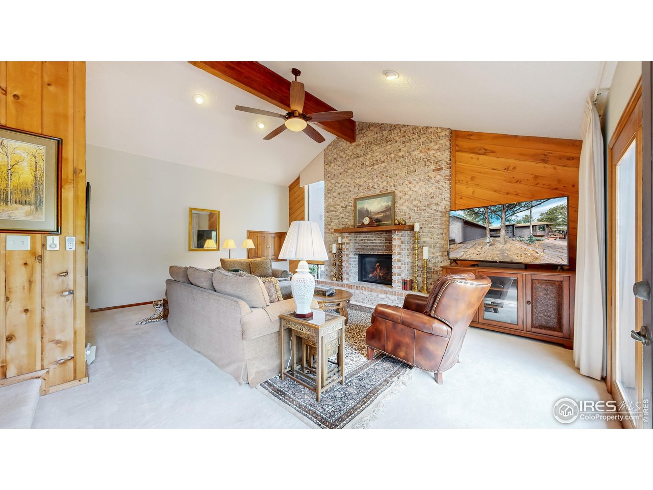 Welcome to your beautifully updated mountain retreat! Located on a serene 1+ acre lot just minutes from downtown Estes Park, this 3 bedroom, 2.5 bathroom home offers the perfect blend of rustic charm and modern comfort. Multiple gathering spaces invite you to relax, including a Sunroom with a wood-burning stove and floor-to-ceiling windows that bring the outdoors in. The spacious living room features a stunning gas fireplace, while the lower-level family room offers another cozy fireplace, ideal for chilly mountain evenings. The kitchen boasts stainless steel appliances, granite countertops, and beautiful cabinetry, seamlessly flowing into the dining area where picture windows frame tree and mountain views. The expansive primary suite includes a sitting area and a large ensuite bathroom, while the second and third bedrooms provide flexible options for guests or a home office. Outside, the private deck and peaceful, mostly level fenced yard offer multiple sitting areas tucked among the trees. Perfect for soaking in the natural beauty around you. Located in a quiet neighborhood just 1.5 miles from downtown shops and restaurants and only 5 miles from Rocky Mountain National Park, this is your chance to own a piece of Estes Park paradise. Don't miss it!