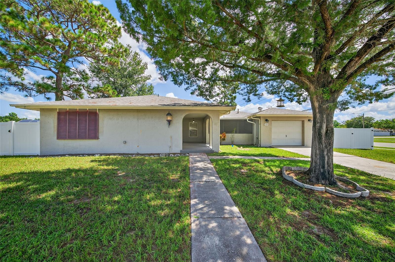 Spacious Pool Home on Corner Lot. Large pool home for under 400,000!!! Your Dream Florida Retreat Awaits!
Welcome to your future oasis! Situated on a generous .40-acre corner lot that has been newly fenced. This charming home immediately captures attention with its alluring arches and impressive curb appeal.
Step inside to discover a thoughtfully designed open floor plan with abundant natural light, brand-new flooring, and a layout perfect for everyday living and entertaining. The sprawling living room offers endless possibilities for relaxation and gatherings, while the oversized primary bedroom provides a true retreat after a long day.

Host memorable dinners in the formal dining room, which seamlessly flows into the unique bricked kitchen—a cook’s dream with plenty of cabinet and counter space to meet all your culinary needs.
Need extra space to work or unwind? Just off the living area, you’ll find a versatile office or den, perfectly positioned next to the 480 sq ft pool deck. Whether you're hosting lively pool parties or enjoying quiet weekend mornings, this outdoor space could easily become your favorite spot.
Additional highlights include:
2017 AC unit

2020 gas water heater

Gas stove

Close proximity to Hudson Beach, shopping, and more
The seller didn’t plan on relocating, so their recent updates are your gain—this move-in ready pool home offers exceptional value, space, and character all in one package.

At this price, you simply won’t find a better opportunity. Schedule your showing today before it’s gone!
