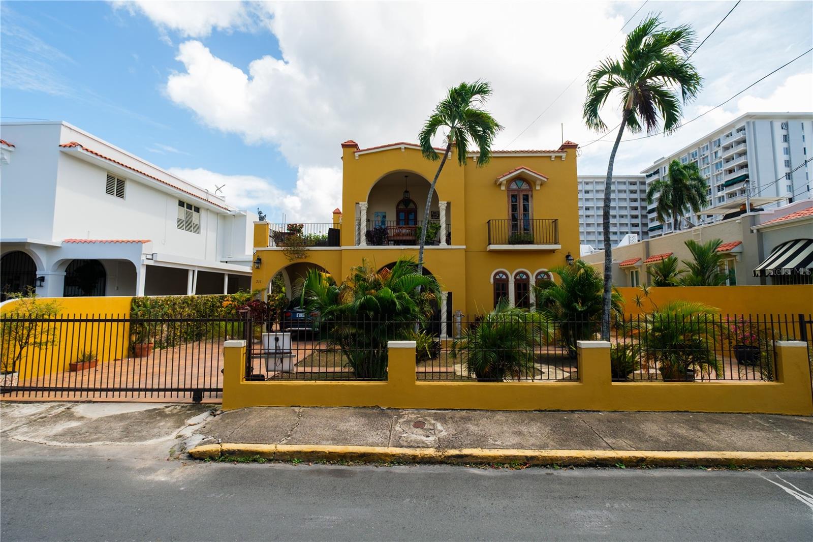 Spanish colonial-style residence in the heart of Miramar, San Juan, situated on one of the neighborhood’s most desirable residential streets. This elegant two-level property offers approximately 5,553 sq. ft. of living space, featuring eight bedrooms and five bathrooms, ideal for both a private residence or investment opportunity.The home showcases classic architectural details, including majestic balconies, original Spanish tile floors, and three open terraces that capture the charm and breezes of this historic district. Spacious living and entertaining areas flow seamlessly to outdoor spaces, creating a warm and inviting atmosphere.Additional features include expansive gardens, two garage areas, and two electric meters, offering flexibility for multifamily use or future subdivision. Located in Miramar’s Historic District, close to private schools, parks, restaurants, cultural venues, and minutes from Condado, Santurce, and the Convention District.A rare opportunity to own a distinctive historic property in one of San Juan’s most sought-after neighborhoods.