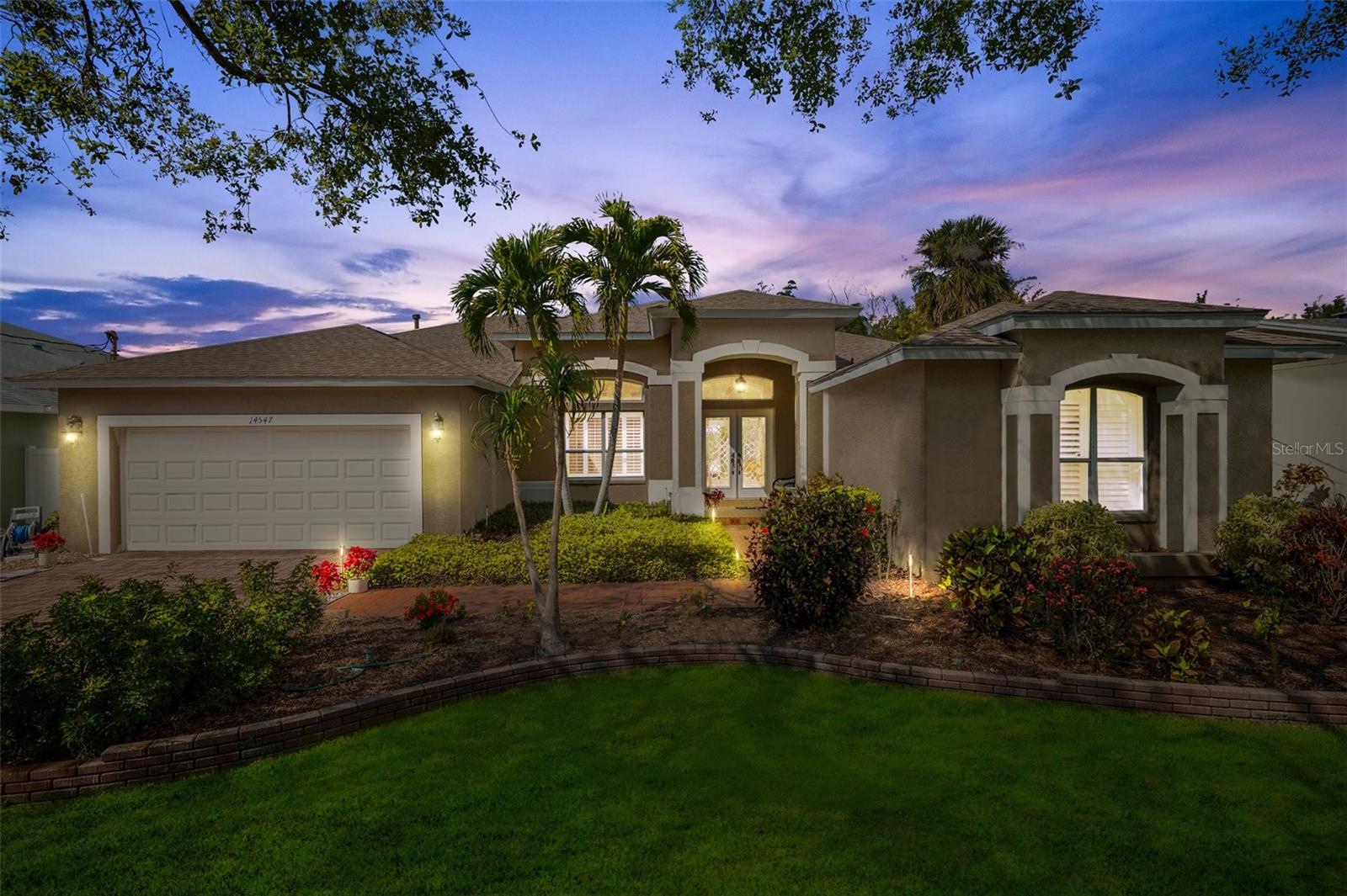 Welcome Home to 14547 Oliver Street!
This beautifully updated 3-bedroom, 2-bathroom home with a versatile bonus room off the Primary (ideal for an office, gym, or creative studio) is your private oasis in paradise!

Step through the leaded-glass door and take in the soaring ceilings, abundant natural light, and a BRAND NEW KITCHEN and APPLIANCES—complete with an impressive 9-foot island overlooking the sparkling pool. Fresh paint throughout, plush new luxury carpet and padding in the bedrooms, and a bonus room off the primary suite add comfort and flexibility to your living space.  Cabinet storage space is tremendous!

Recent upgrades include *new ceiling fans, toilets, the “B” side of the electrical panel, irrigation control box, gas hot water tank, and propane tank*.

Step outside to your tropical retreat—lush landscaping surrounds a dazzling pool and relaxing jacuzzi. Love to golf? You’ll be thrilled with your very own putting green, perfect for practicing your short game under the Florida sun.

Located just minutes from top-rated restaurants, Publix, Walsingham Park, the scenic Pinellas Trail, and best of all—Indian Rocks Beach is less than a mile away!

This home isn’t just a place to live—it’s a lifestyle.
Come fall in love with 14547 Oliver Street today!