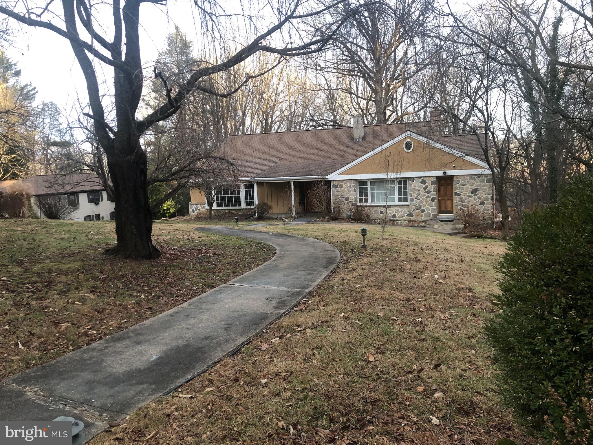Please note  Larry  Starkman has a Broker's License  not an  Associate Broker's License. This lovely, spacious 3  level  home features 6 bedrooms, 2 full bathrooms and 1 powder room . There is close to 2 acres of land.The lower level is comprised of 2 bedrooms with wall to wall carpeting, full expanded modern bathroom and a den area. The den is comprised of a  wet bar area, 2 brick, wood  fireplaces,doors that lead out to the rear yard . The doors also lead to a rear patio and a rear wood deck with steps.This level would  also make an excellent In-Law Suite.The main floor(2nd floor) is comprised of a full eat in kitchen with a breakfast nook and doors that lead to the rear deck with  steps. This main area also has a laundry room area with a washer and dryer(included in as is condition).The laundry also has another wood door leading to the front yard.  There is also a formal dining room, spacious LR, and a modern powder room. There is also beautiful hardwood flooring, The upper level(3rd Floor) is comprised of 4 bedrooms and a full modern bathroom. Small basement and a attached 2-car garage.Remote garage door. Only minutes to highways, public transportation,the Wynnewood Train Station, shopping , supermarkets, numerous eating establishments and Banks The Philadelphia International Airport is also close by.
