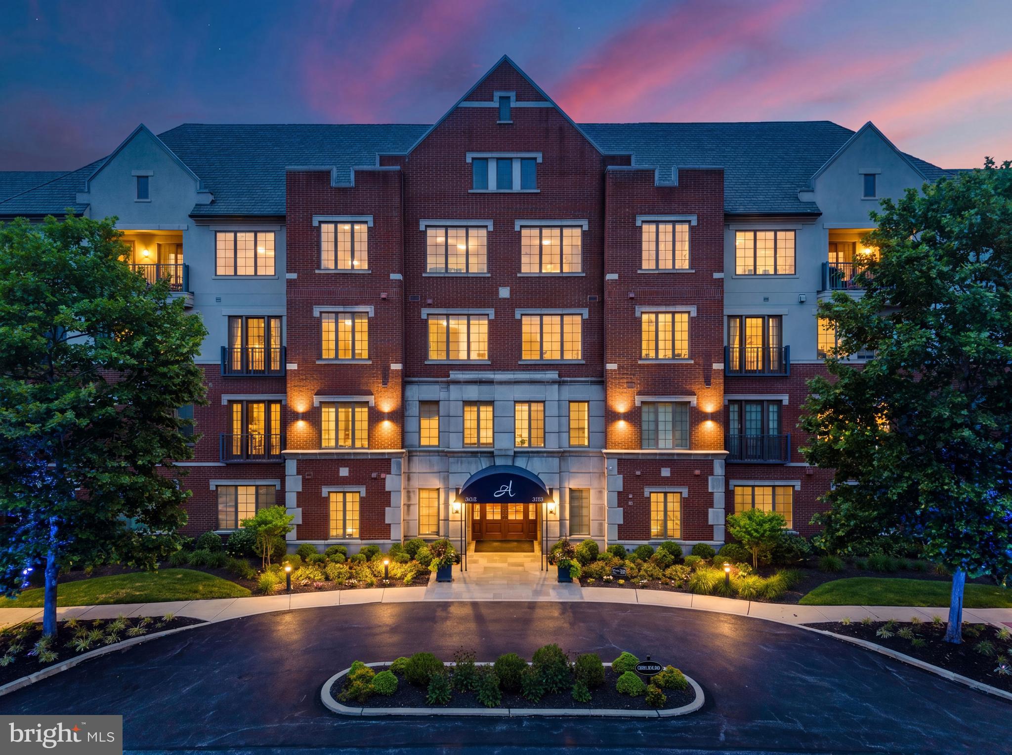 Welcome to luxury living at Athertyn at Haverford Reserve, Pohlig's premier 55+ community on the Main Line. This impeccably customized 1,809 sq. ft. Addison model offers 2 bedrooms, 2 full baths, and an exceptional collection of designer upgrades throughout. From the moment you step inside, you'll be captivated by the elegant foyer, featuring custom wallpaper and a stunning statement chandelier that sets the tone for the sophisticated interiors beyond. Designed with both comfort and entertaining in mind, the open-concept floor plan seamlessly connects the gourmet kitchen, complete with a large center island, breakfast bar, and eat-in dining area, to the spacious living room and formal dining room. Plantation shutters add natural light to the living room and breakfast area, while the formal dining room is beautifully appointed with custom wallpaper and a striking designer chandelier, creating the perfect setting for hosting family and friends. The luxurious primary suite offers custom-designed closets, remote-controlled blackout shades, and a spa-inspired ensuite bath. Additional highlights include a dedicated laundry room with custom storage, premium finishes throughout, one assigned parking space in the secure underground garage, and a private storage unit. (See attached upgrade list for the complete list of enhancements.) Perfectly positioned on the first floor for convenient outdoor access, this truly turnkey residence is nestled within the picturesque 209-acre Haverford Reserve. Residents enjoy maintenance-free living, secured building access, an elegant lobby with a convenient mail center, and exclusive amenities including a clubhouse, fitness center, resort-style pool, tennis and pickleball courts, putting green, and miles of scenic walking trails.