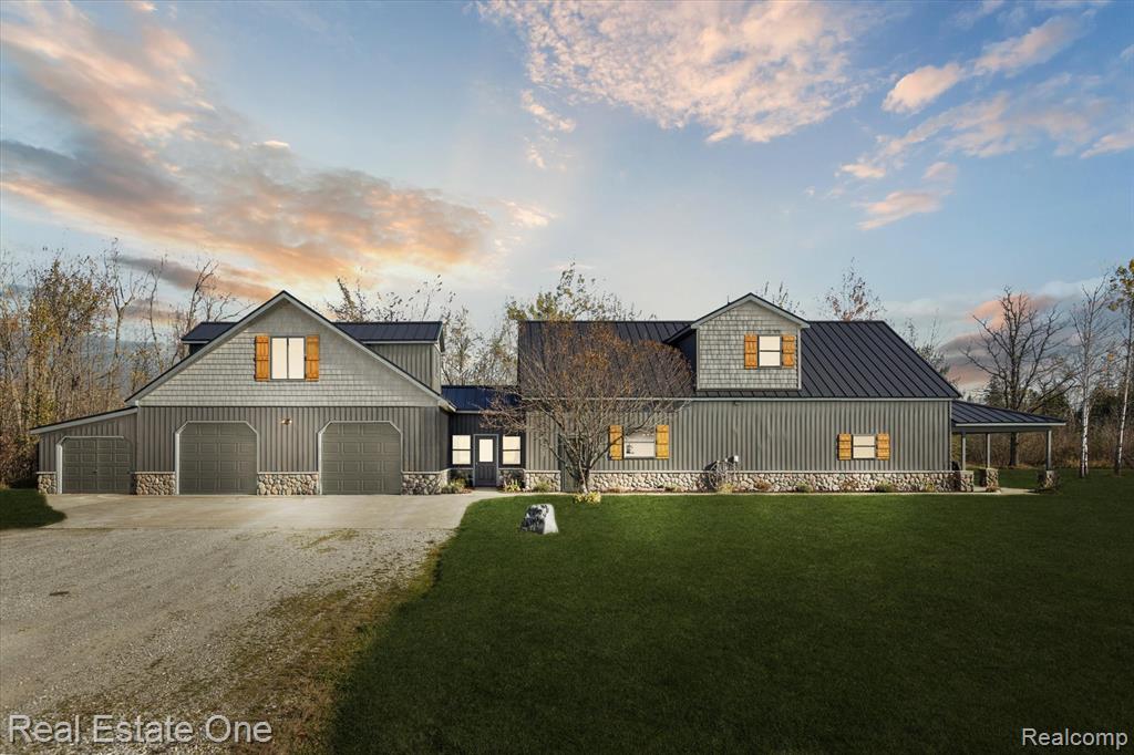 Discover the ultimate blend of comfort and sophistication with this fully furnished, turnkey property set on nearly 40 acres along the serene Black River in Cheboygan. Designed for both relaxation and recreation, this estate offers unmatched access to Northern Michigan’s natural beauty — with opportunities to hunt, fish, kayak, and explore just minutes from Black Lake and Black Mountain.
The beautifully updated main residence features 3 spacious bedrooms and 2 baths, highlighted by an open-concept living area with a stylish kitchen, dining, and great room. Recent high-end updates include new siding and windows (2023), a new steel roof with stone accents (2024), and a stunning covered porch with stamped concrete patio — perfect for entertaining or taking in the peaceful surroundings.
A private guest apartment with its own entry and utilities offers 1 bedroom, 2 baths, a full kitchen, and heated garage — ideal for guests or income potential. Completing the property are a large pole barn, pavilion, dock, and storage shed, creating a rare opportunity to own a luxurious four-season retreat in Northern Michigan’s most scenic setting.