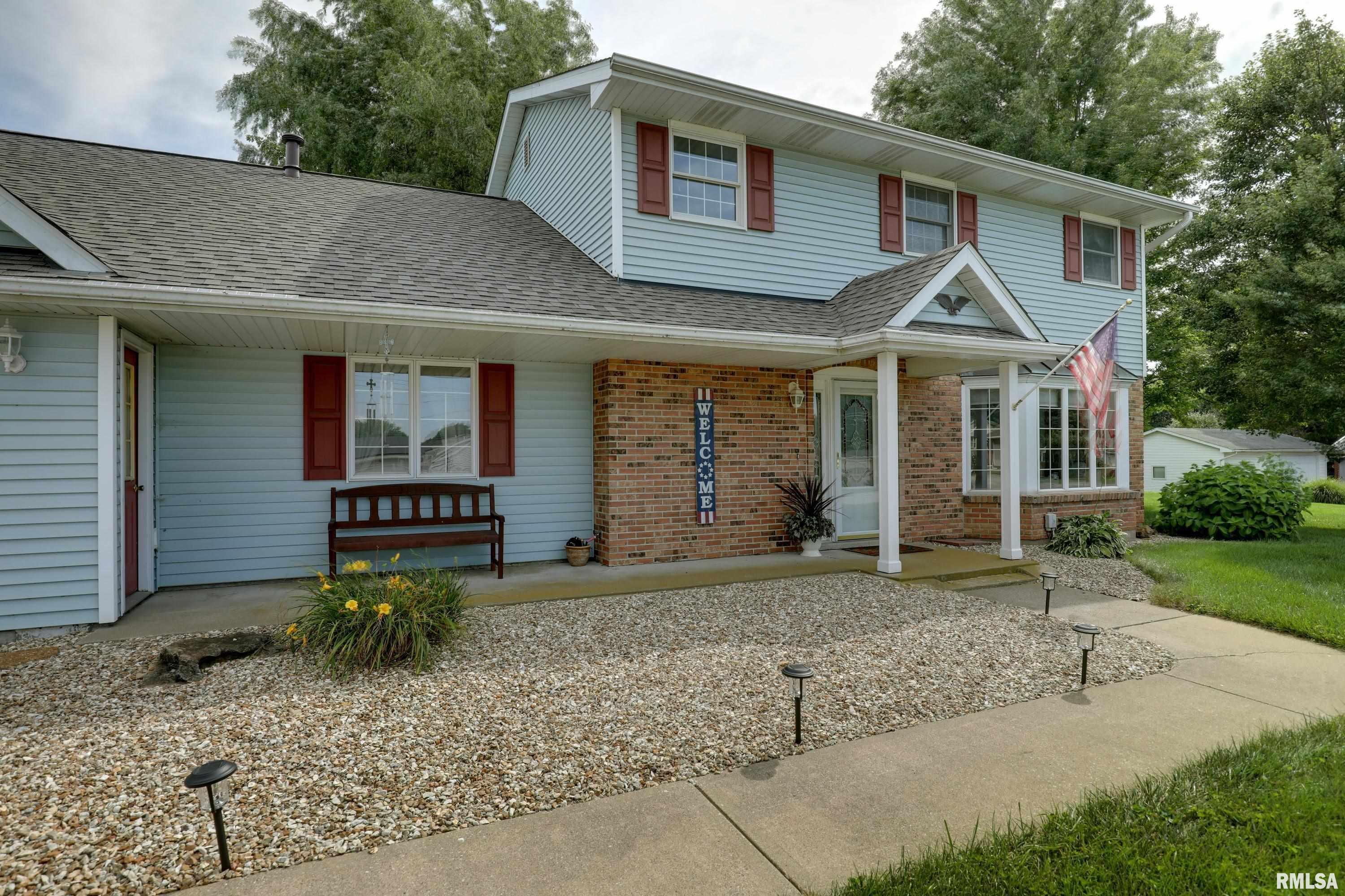 This spacious five bedroom, two and a half bath home is nestled on two lots totaling a full acre on the peaceful south edge of Quincy.  This well maintained property offers the perfect combination of space, comfort, and quiet country surroundings while being just minutes from town. The main floor features a large living area complete with a cozy fireplace and a spacious kitchen with informal dining that opens directly to a fantastic paved patio, creating a wonderful space for relaxing, entertaining, or simply enjoying the peaceful setting. The convenient main floor laundry/mudroom is a great perk! All five bedrooms offer generous space, with two featuring skylights that bring in an abundance of natural light. The massive 11x18 primary suite includes its own private half bath. There is also excellent storage throughout the home, including additional storage space above the attached two car garage conveniently accessed from inside the house.   Outside the property truly shines with a flat yard, an attached two car garage, and an additional workshop providing plenty of room for hobbies and projects. It backs to open fields, creating a beautiful view and a wonderfully peaceful setting. This home has been lovingly maintained over the years and features double pane vinyl replacement windows and a new roof installed in 2025. Spacious rooms, abundant storage, fantastic outdoor living space, and an exceptional setting make this a rare opportunity for space, privacy, and convenience!