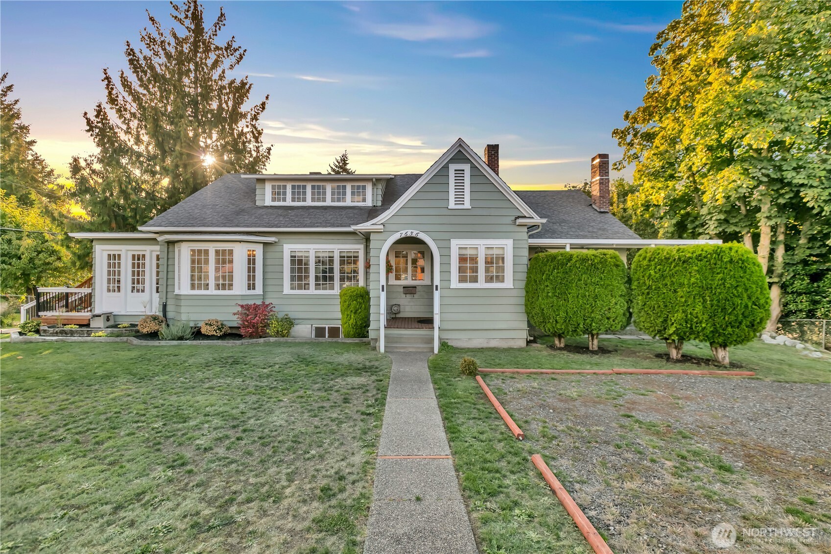 Spacious 1920s Craftsman Revival-style home offering flexible living options, including multi-generational living, live/work use, or rental potential. This home showcases original detail and charm, with leaded-glass built-ins, French doors, crystal fixtures, oak floors, and stunning fireplaces highlighting its period design. The open main-level layout flows seamlessly from the living room to the dining area and sunroom, with multiple deck access points, and includes 3 bedrooms and a kitchen with breakfast nook. The upper level offers 2 bedrooms, a living room, office or bonus room, 3/4 bath, and space for a kitchen. The upper level currently connects to the main level but can be separated if desired, with access available from the exterior stairs. The lower level adds 2 bedrooms w/new code-compliant windows, a living room, 3/4 bath, kitchen space, laundry, and large storage or flex spaces. With multiple rooms and levels, the layout supports a variety of living arrangements. Each level has private access, and there is ample parking with a total of 9 parking spaces, including the garage. RCX zoning allows up to 25% commercial use, offering flexibility for a home-based business or professional office. Additional features include a garage with ADU potential, double lot, fully fenced yard, new 80-gallon hybrid water heater, pre-inspection, and an assumable 2.7% loan available to qualified VA and non-VA buyers. A special opportunity to own a piece of Tacoma’s architectural history!