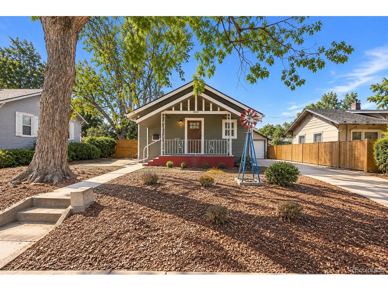 Timeless bungalow charm meets fresh, modern design at 4035 S Sherman Street! Thoughtfully remodeled, this 4-bedroom, 2-bath home offers 1,341 finished square feet in Englewood's established South Broadway Heights neighborhood. Bright interiors, warm wood tones, and contemporary finishes create an inviting atmosphere throughout. The main level kitchen features sleek cabinetry, stainless steel appliances, and breakfast bar seating, while the beautifully updated bathrooms showcase statement tile, modern fixtures, and stylish vanities.Two bedrooms and a full bathroom occupy the main level. The finished basement adds two additional bedrooms, a three quarter bathroom, and a versatile living area for movie nights, hobbies, or a home office. A convenient downstairs kitchenette, with a refrigerator included, adds everyday functionality.Set on a 6,403-square-foot lot, the property offers a spacious backyard with room to personalize your outdoor retreat, storage sheds, and four off-street parking spaces. Central air, double-pane windows, and no HOA add to the appeal. Enjoy convenient access to shopping, dining, schools, and major roadways. A beautiful blend of character, thoughtful updates, and flexible living space!