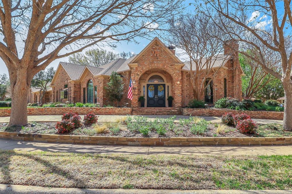 Luxury living at its best in this totally private custom designed home retreat situated on a quiet cul-de-sac and set on nearly half an acre lot in highly coveted West Plano.  This superior north-facing spacious 5 bedrooms, 4 bedrooms on first floor home offers an exceptional blend of elegant interior space and resort-style outdoor view of backyard pool from its living areas. It's an outdoor vacation. The primarily one-story home concept boasts of an incredible backyard lifestyle featuring an inviting sparkling pool and spa with a tranquil waterfall and 3 covered patios showcasing designer pergola and an outdoor kitchen that offers memory-making times with friends and family in this private fenced backyard.  Decorator-influenced interior welcomes all to a grand entry boasting of double doors and hardwood floors opening to two living areas for family living or entertaining ease.  Inviting downstairs living areas showcase 2 fireplaces, exquisite picture paneling, elevated ceilings, walk-in bar area with sink, beverage fridge, and extensive crown molding while offering flexibility as a study or sitting area.  Formal Dining Room features hardwood flooring, classic wainscoting, and can easily serve as a dining space or a flexible game area.  Gourmet chef's kitchen boasts of 5 burner cooktop, abundant cabinetry, custom cooktop Venta Hood, breakfast bar, center work island, designer window planter box, and separate utility room with extensive shelving, cabinets, and sink.  Primary Bedroom is upgraded with cast stone fireplace and built-in cabinets for television and drawer plus shelving. Primary Bedroom is perfect as an attached room with built-in shelving, fireplace, & multiple options for an office or nursery. Upstairs spacious room with a full bath has multiple potential uses as a 3rd living area or 5th bedroom. For enhanced security and to accentuate the extensive landscaping this home includes Custom LED Landscape Lighting Controllers for both front-yard and back-yard