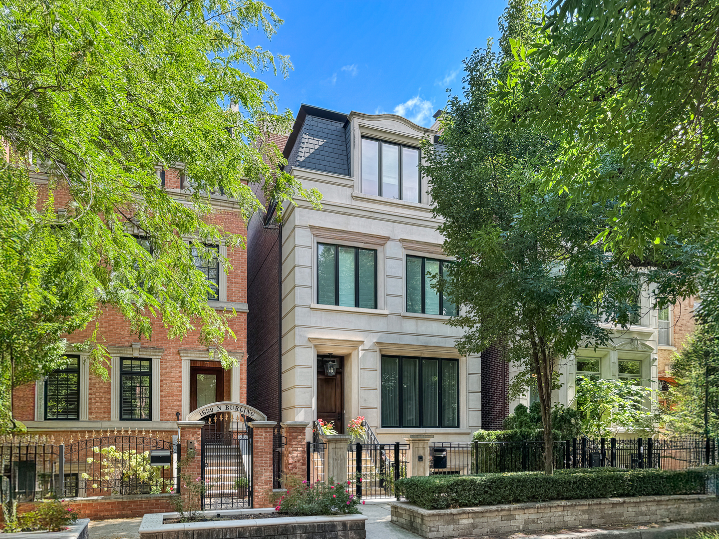 This exceptional 6,200+ square-foot, six-bedroom home on coveted Burling Street offers the best of city living. Behind its classic limestone facade lies sophisticated, high-end finishes, a four-stop passenger elevator, incredible outdoor space, and a heated, attached 2+-car garage.  The main level is designed for entertaining, featuring 4" rift-sawn oak floors, elegant crown molding, two fireplaces, custom window treatments (including motorized shades), and built-in speakers. The kitchen and butler's pantry are outfitted with premium Sub-Zero, Wolf, and Bosch appliances, a large island with breakfast bar seating, and a built-in banquette. The adjoining family room includes a coffered ceiling and a fireplace flanked by custom cabinetry, seamlessly blending with the kitchen's design.  Each of the six bedrooms includes its own full bath, complemented by two additional powder rooms for guests. Bath fixtures include top-tier brands such as Kallista. The luxurious primary suite features a spacious bedroom with a custom entertainment center, dual walk-in closets, and a spa-inspired bath with dual vanities, a steam shower, and a freestanding tub.  Additional highlights include professionally organized closets throughout, two laundry centers, a mudroom, a three-zone HVAC system, radiant heat in the home, garage, and front steps, plus a Generac generator for added peace of mind.  Ideally located, this home is walking distance to nearby popular restaurants, Steppenwolf Theatre, the Apple Store, Whole Foods, the Red Line, and top-rated public and private schools, including Latin, Parker, Catherine Cook, and Lincoln Park High School.  Homes with this combination of quality, size, and location rarely come to market-don't miss the opportunity to make it yours.