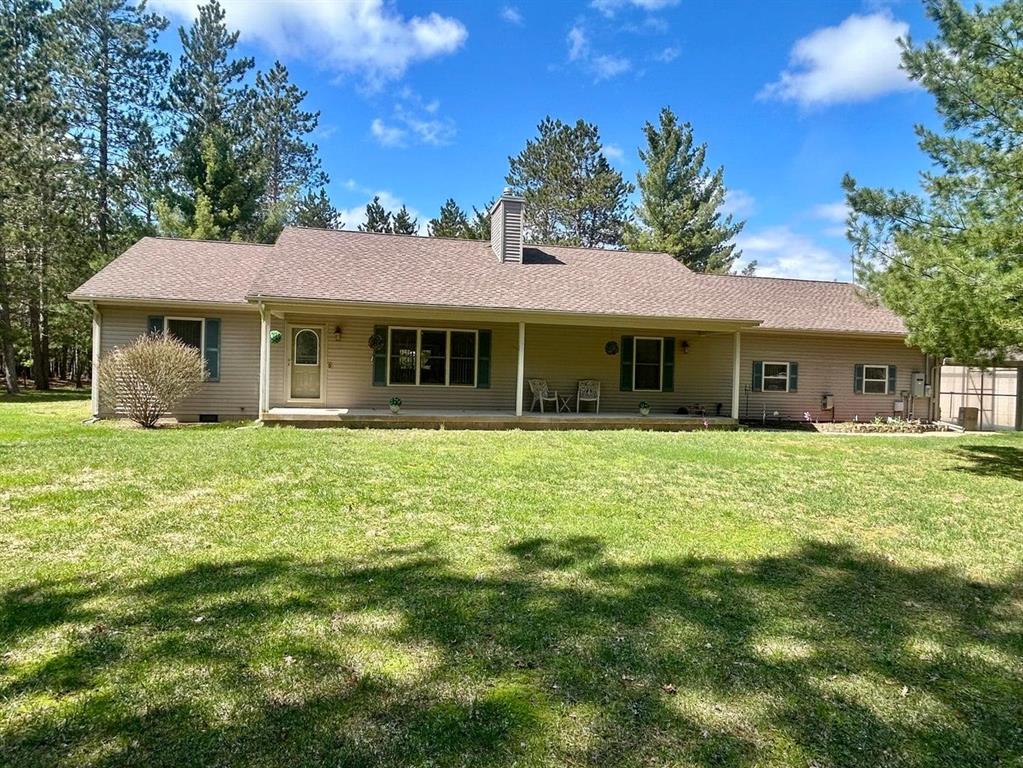 WOW! This stunning 2,440 sq ft ranch truly has it all, set on just over 10 beautifully maintained acres complete with groomed trails throughout and only a couple of miles from Higgins Lake access. Inside, you'll appreciate the thoughtfully designed split floor plan, featuring a spacious primary suite with ample room for a private sitting area or in-home office. Need a fourth bedroom? This space can easily be converted with the simple addition of a wall and door. The former attached garage has been expertly transformed into additional living space, offering a bedroom and a large family room with an impressive wet bar, ideal for entertaining and hosting gatherings. Step outside to enjoy both a 6' x 40' covered front porch and a 27' x 12' covered side porch, which could easily be enclosed for year-round use. The backyard also features a fenced 24' x 46' area, perfect for pets or small animals. For those who need extra space, the property includes a 28' x 36' insulated, drywalled, and heated garage, complete with an oven for outdoor entertaining. In addition, there's a 30' x 40' pole barn with 10' ceilings adding extra space for storing equipment, vehicles, or recreational toys. An outdoor wood boiler, paired with an 18' x 42' woodshed, helps efficiently heat the home and water, keeping utility costs low. Plus, a Generac backup system provides peace of mind, ensuring continuous power and heat when you need it most. Don't miss your chance to experience everything this incredible property has to offer, schedule your showing today before it's gone!