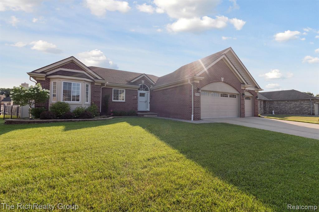THIS IS IT!!!  Everything has been done and all you need to do is move in and enjoy. This absolutely  stunning ranch home features 3 bedrooms, 2 full baths, 2 half baths and a 3 car garage.  Kitchen remodeled in 2017. Bathroom remodeled in 2022. All windows replaced in 2014. Door wall has built in blinds. Newer hardwood floors in great room, foyer and hall. Cathedral ceilings in great room. Trex decking. Whole house generator by Generac. Tank less hot water.  Full finished wide open  basement with bar and 1/2 bath. Rear 10x8 shed. 3 car garage with epoxy floor and room for your extra toys. Gas fireplace in great room. Vinyl fencing in rear.