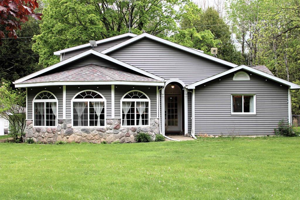 This beautifully updated 3 bedroom 2 bath home nestled on 9 wooded acres with a creek running through the property is surrounded by nature's tranquility. There is plenty of space for entertaining in the naturally lit living room and outdoors in the yard or enjoying the acreage. The kitchen offers plenty of prep space on stunning quartz counter tops with an additional bar and island. The upstairs primary suite has a large walk-in closet, separate room that could be an office or second closet. The ensuite bathroom has a double vanity, large, jetted tub with tile surround, heated floors, tiled shower and private water closet. Enjoy country living with prime hunting land just 4 miles from downtown Victorian West Branch where you will find many restaurants, bars, unique shops, and all the necessities but just 3 miles from the nearest hospital and medical facilities.
