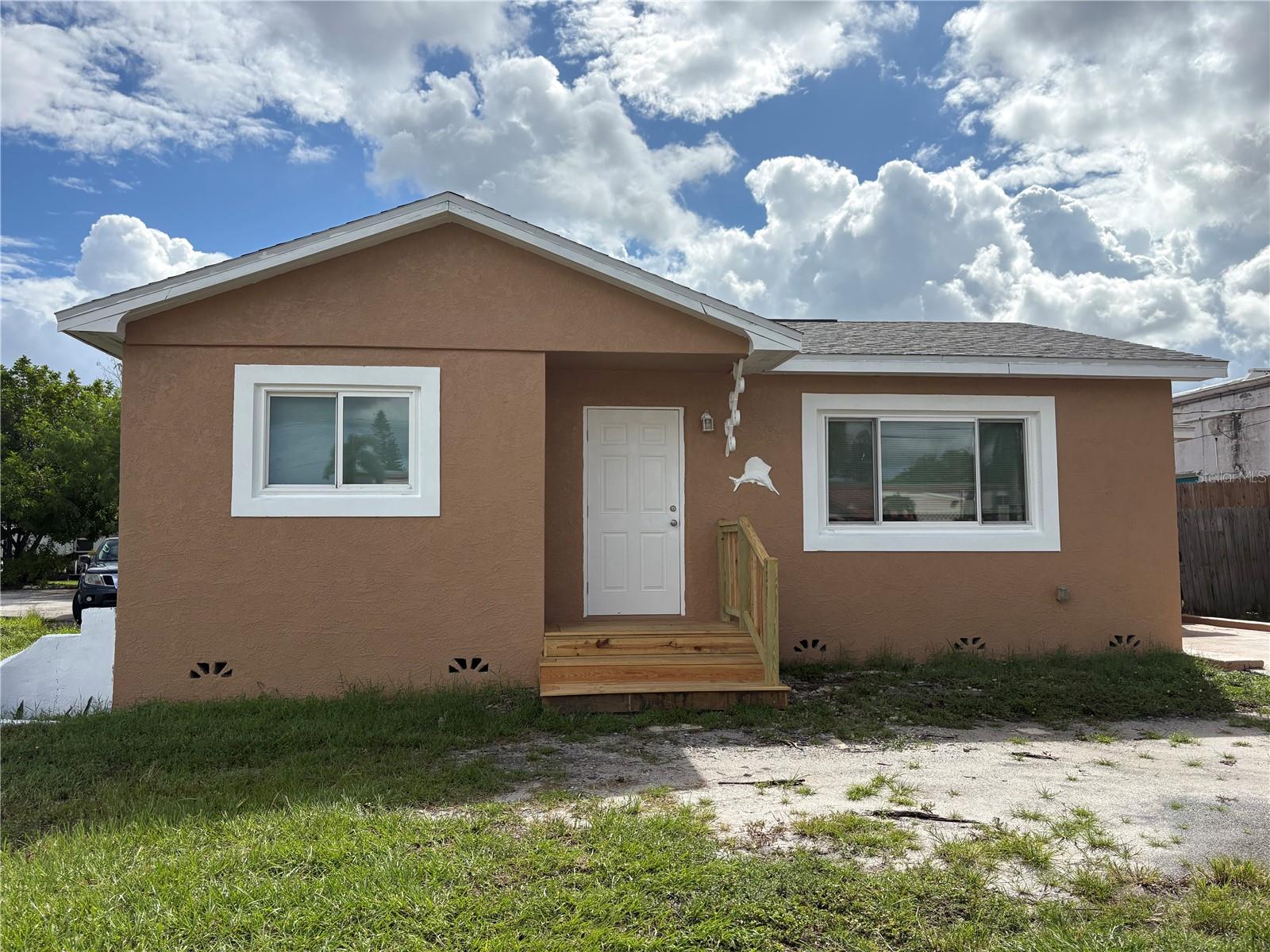 Great opportunity to own a charming 2-bedroom, 1-bath home offering approximately 812 square feet of living space. The home features hardwood floors, a laundry area, and a functional floor plan with comfortable living space. Recent major improvements include a new roof and AC system installed in 2018, providing added peace of mind for the next owner. The property is serviced by a septic system. Property is zoned B-1 General Commercial zoning, offering potential for a variety of uses, subject to local zoning requirements and approvals. Please verify with city for both residential and business use. Agent owned and room sizes are estimated.