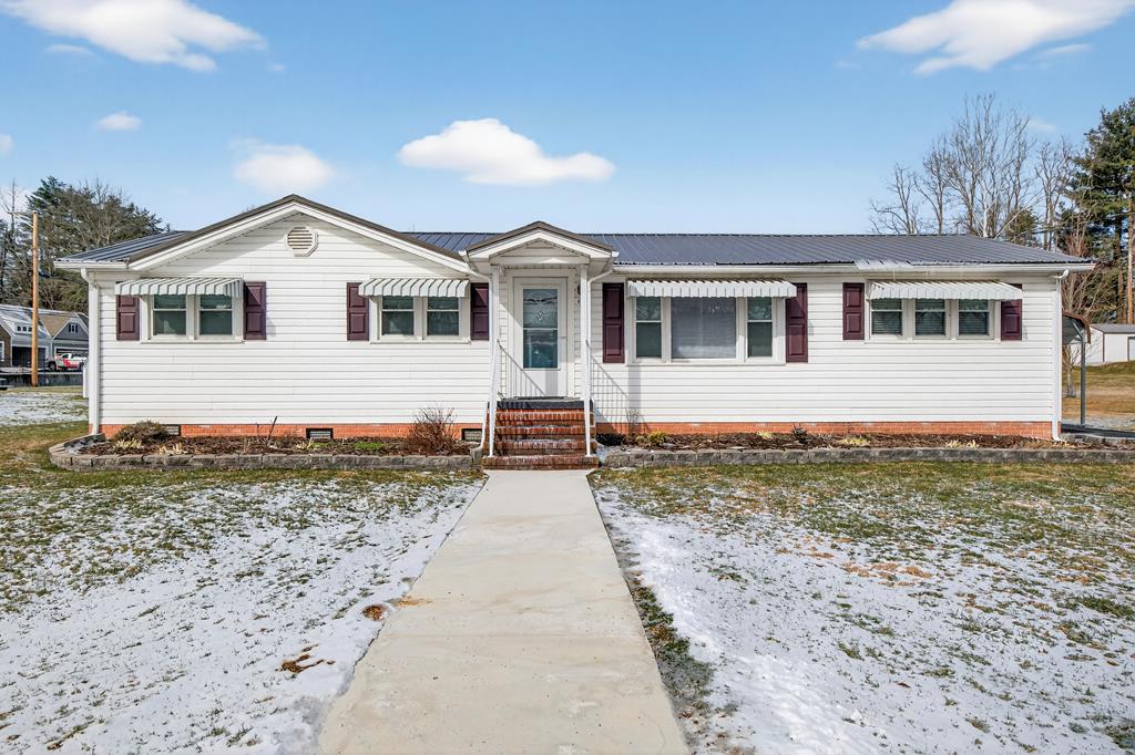 Have you been looking for a one level, easy to maintain home.  This is it!!  Great location for this ranch home!!  Lot is level with flowering cherry and a cypress tree.  Covered parking for your vehicle and convenient off the side door which enters into the laundry area. Another great attribute is an attached storage shed with shelving and electricity.  Many updates within the past 2 years including, but not limited to, metal roof in 2024, windows in 2023, vinyl in bath and storm door. Inside this home it is clean as a pin.  Kitchen is expansive with exterior door leading to the covered deck to enjoy the outdoors.  Home is convenient for walking to downtown Abingdon, and all the town has to offer.  Don't wait!  Schedule your private showing today!!