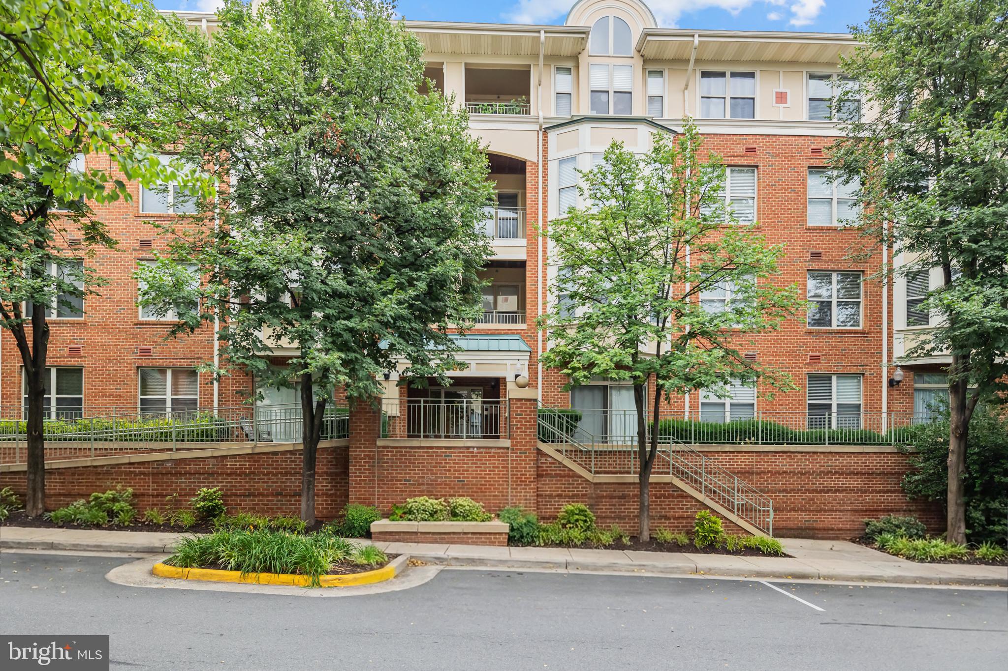 Welcome to this beautiful corner unit condominium in the highly sought-after Stratford community, just steps from Reston Town Center. This rarely available corner-floor plan offers over 1,300 square feet of comfortable living space with an open layout designed for both everyday living and entertaining. The thoughtfully renovated kitchen (2018) features abundant cabinetry, custom pull-out storage solutions, and a custom breakfast area that seamlessly connects to the main living and dining spaces. Elegant crown molding extends throughout the home, adding timeless character and sophistication. Recent updates provide peace of mind, including a new HVAC system (2025), microwave (2025), and dishwasher (2025). The living room, dining room, and bedrooms feature updated flooring (2018), while both bathrooms have been tastefully renovated with modern shower upgrades. Enjoy the warmth of the fireplace, spacious living areas, and the convenience of one-level condo living. Residents of Stratford enjoy desirable amenities including a pool, fitness center, clubhouse, elevator access, extra storage, and garage parking. Ideally located near Reston Town Center, Metro access, shopping, dining, trails, and commuter routes, this move-in-ready home offers the perfect blend of comfort, style, and convenience.