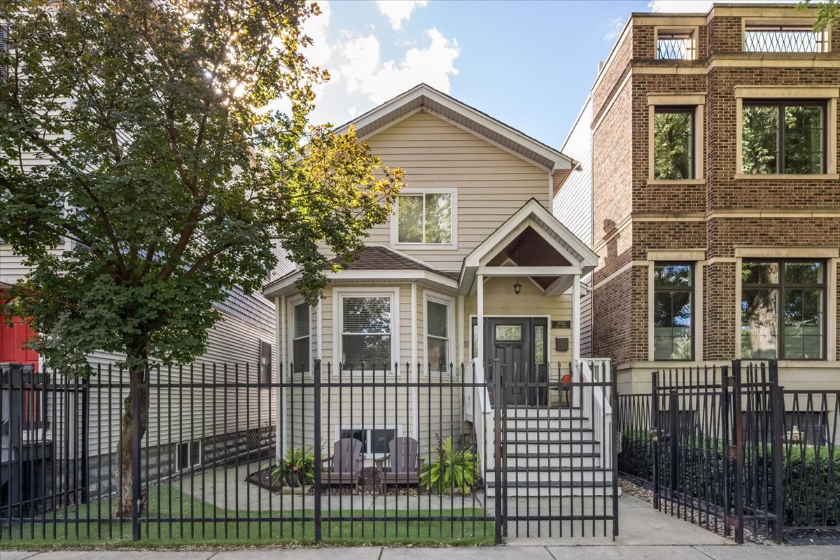 Immaculate single-family home on a picturesque tree-lined street perfectly located in the heart of West Lakeview steps from Hamlin Park and a close stroll to the Roscoe Village strip, great shopping, trendy restaurants and the Paulina Brown Line. Amazing curb appeal abound for this charming home with a welcoming front porch ideal for morning coffee or evening drinks.   The thoughtfully designed main living level has an expansive front living/dining area featuring a wood-burning fireplace with multiple seating areas, a classic bay window and powder room. Rehabbed in 2023, the eat-in chef's kitchen features white cabinets with quartz countertops, stainless steel appliances, designer lighting, a large island with counter seating and a built-in banquette for informal dining. The spacious upstairs has three bedrooms up with a luxe primary suite with walk-in closet and a well appointed primary bathroom. Finishing the upstairs  level are two equal sized bedrooms and a pristine full bathroom. The lower-level has front and rear staircases and went through a major renovation in 2023. Previously a crawl space with 5ft ceilings, the basement was dugout creating an amazing family room space with 8ft ceilings, a brand new full bathroom with walk-in shower and a 4th bedroom with large office space perfect setup for out of town guests. Completing this one of a kind home is an outdoor lover's paradise with a large deck directly off the kitchen, a massive grass yard and a two car garage. A truly must see home on the best block in the West Lakeview Hamlin Park area located in the Jahn School District.