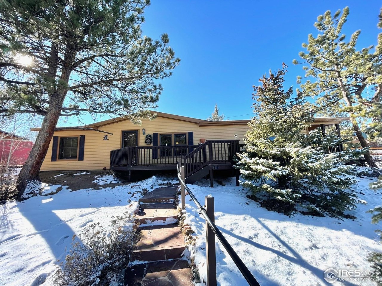 A great opportunity to own a home in Estes Park! Seller is offering a $10,000 credit for closing costs. A very well cared for manufactured home on a foundation. fenced back yard with storage shed. Wrap around deck. Skylights and vaulted ceilings. 3 bedroom 2 bath with hardwood floors. Upgraded doors and kitchen cabinets. New disposal. Storage building included. Would make a great full time residence or a second home for weekend getaways. HOA is Voluntary.