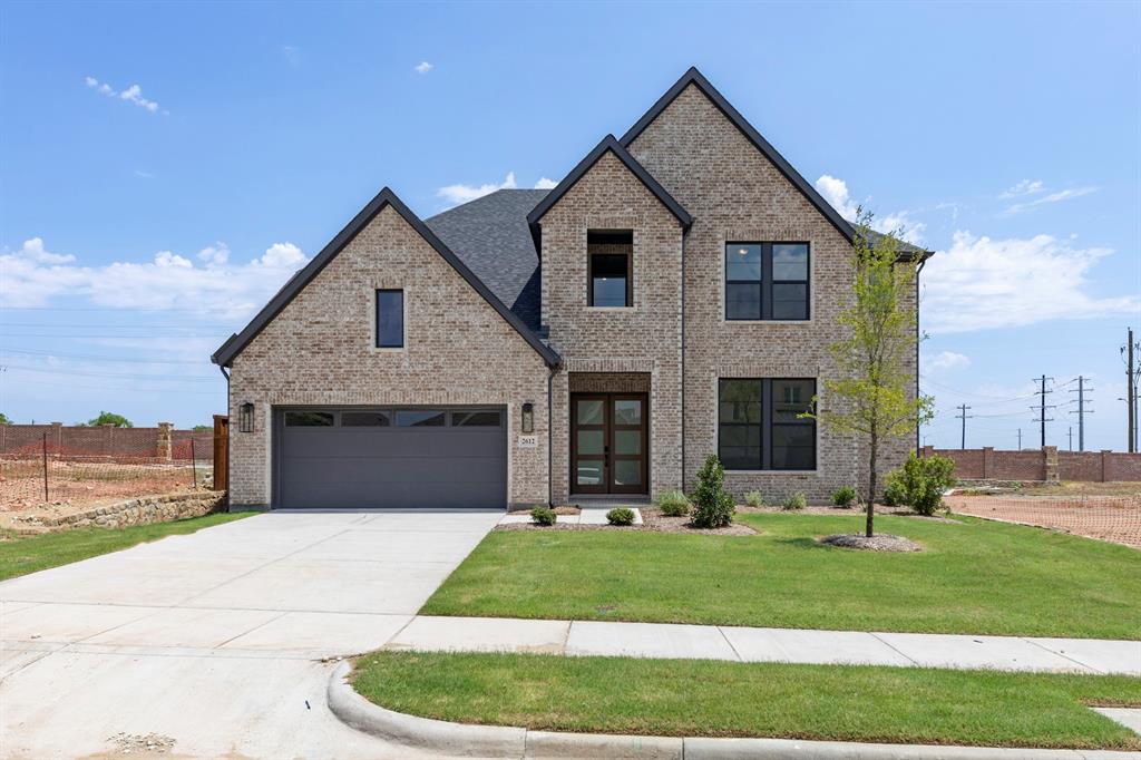 MLS# 21185456 - Built by Drees Custom Homes - Ready Now! ~ The vaulted ceiling and cozy fireplace in the family room create a warm, inviting atmosphere perfect for relaxing or entertaining. Upstairs, you’ll find two bedrooms along with a spacious media and game room. The lower level offers two additional bedrooms, a private office, and a stunning curved staircase that opens dramatically to the floor above.