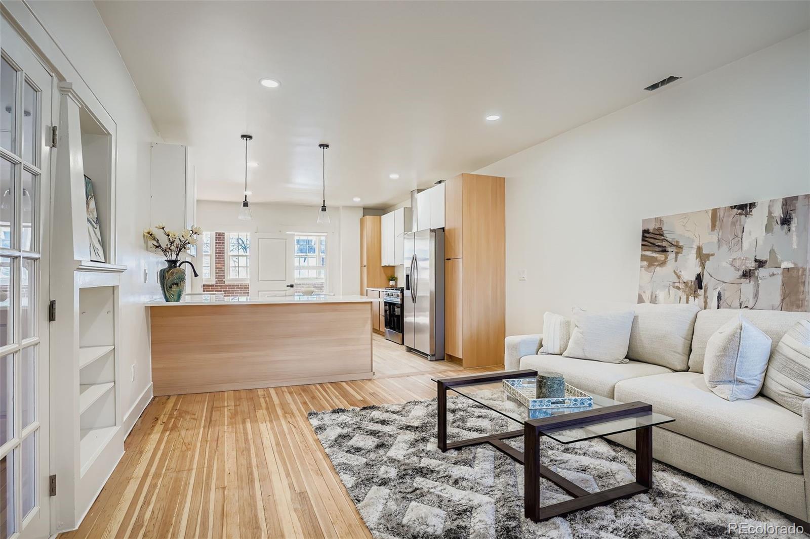 Move-in ready with approximately 2,056 finished sq ft, including 1,118 above grade and 938 in the walk-out basement featuring private exterior access and a non-conforming bedroom ideal for guests or a home office. The open-concept main level showcases exposed brick, hardwood floors, abundant natural light, and a versatile sunroom perfect for a gym or flex workspace. The updated kitchen blends modern design with everyday function. Recent upgrades include a brand-new HVAC system, 5-year roof certification, energy-efficient windows, and upgraded insulation for improved comfort and efficiency. Additional highlights include an attached 1-car garage, off-street parking, and a fully fenced yard built for pets and entertaining. Enjoy unbeatable walkability - bike or stroll to Sloan’s Lake trails, Edgewater shops, Highlands Square dining, and quick access to Downtown Denver. Schedule your showing today.This property is managed by a party wall.