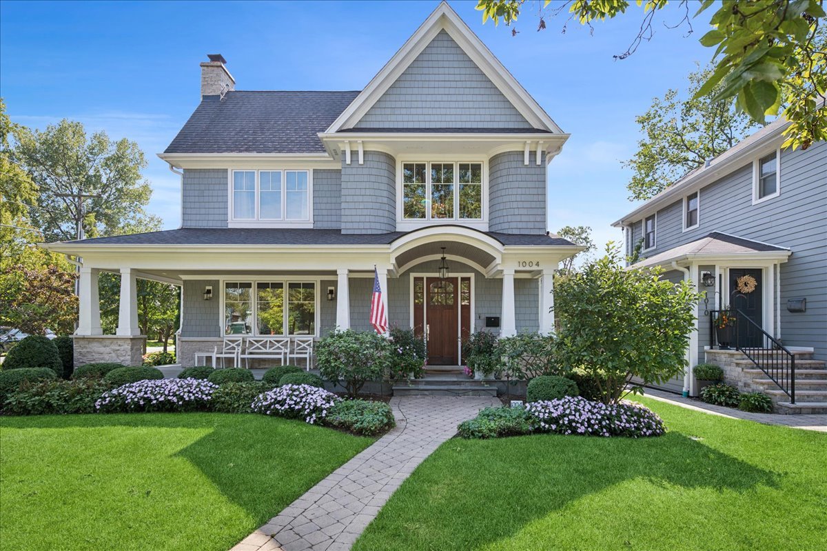 Nestled in the vibrant heart of Winnetka, 1004 Oak Street is a 2015-built, Nantucket-style masterpiece that redefines luxury living. Perfectly positioned just steps from the train, charming downtown, acclaimed restaurants, serene parks, and top-rated schools, this custom home on an oversized corner lot seamlessly blends timeless elegance with everyday functionality.        The exterior stuns with classic cedar shake siding, premium windows, lush landscaping, and a fully fenced yard. The private backyard retreat is ideal for year-round entertaining, featuring a built-in outdoor kitchen, custom firepit, secondary fireplace, outdoor TV, multiple bluestone patios, and beautifully designed green space.        Inside, refined craftsmanship abounds-10-foot ceilings, rich hardwood floors, detailed custom millwork, and integrated speaker systems set a sophisticated tone throughout the main level. The open-concept floor plan includes a gracious living room and formal dining room, ideal for elegant entertaining. A handsome office with custom built-ins provides a quiet workspace, while a spacious mudroom adds everyday convenience. Anchored by a fireplace, the inviting family room flows effortlessly into the chef's kitchen, which features soft-close cabinetry, an oversized island, dual Sub-Zero refrigerator and freezer, Wolf double oven, built-in microwave, and a sun-drenched breakfast room.        Upstairs, the second and third floors offer four spacious bedrooms, each with en suite bathrooms and custom closets. The luxurious primary suite includes dual walk-in closets, a private balcony, and a spa-inspired marble bathroom with soaking tub, oversized shower, dual vanities, and marble countertops. A full second-floor laundry room completes the upper level.        The finished lower level elevates the home's entertaining appeal, featuring a sleek bar, wine room, large recreation space, fitness room, fifth bedroom, full bath, and abundant storage.        With classic design, generous living space, and a premier in-town location, 1004 Oak Street is a rare sanctuary in one of the North Shore's most coveted communities.