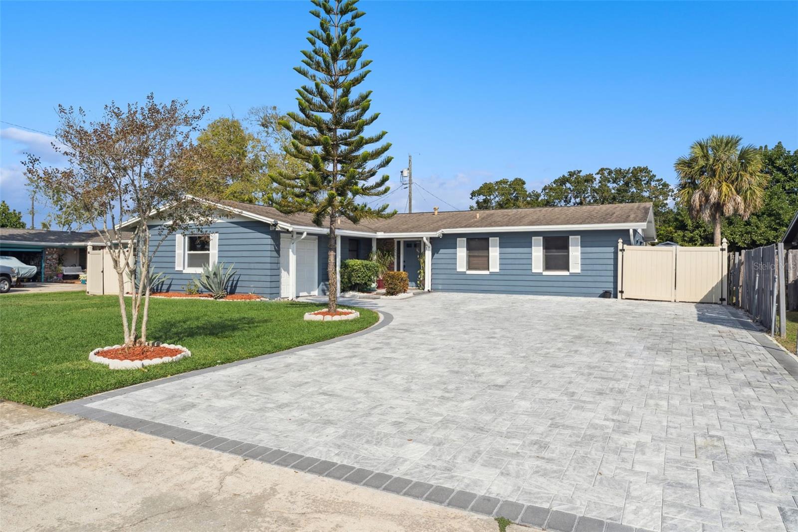 Welcome to your dream home! This beautifully updated single-family residence offers a spacious and comfortable living environment perfect for families and entertainers alike. Conveniently located near shopping malls and popular theme parks, this property combines comfort, style, and an unbeatable location. Featuring 5 Bedrooms, 2 Bathrooms: Ample space for family and guests. A modern kitchen. A separate entrance is available for the 5th bedroom (garage conversion), adding an opportunity for rental income. Oversized driveway for ample parking featuring beautiful gray-tone pavers. Private swimming pool recently resurfaced in 2023, ready for year-round enjoyment. Enjoy Florida's beautiful weather in the expansive screened-in 28’x19’ porch, ideal for entertaining large groups or enjoying quiet evenings. Gather with friends and family for cozy evenings under the stars in the cooler month around the outdoor fire pit. Only minutes from shopping malls, dining, and world-famous theme parks. Don’t miss your chance to own this exceptional home!