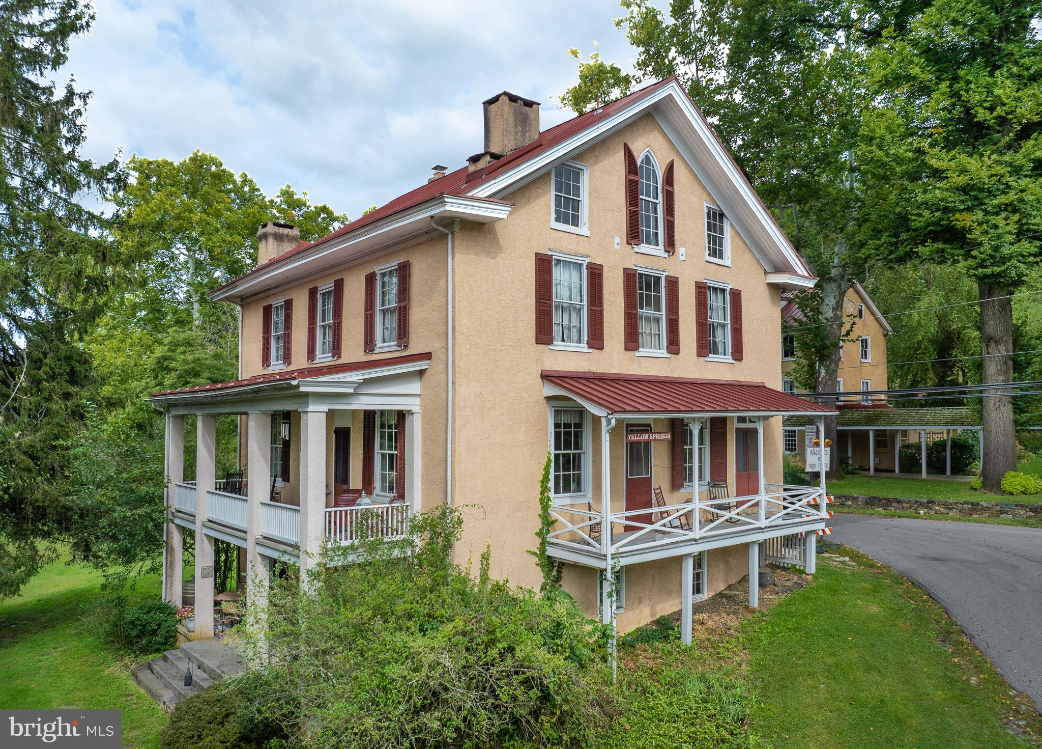 Welcome to 1690 Yellow Springs Road — a piece of Chester Springs history!Set in the heart of the charming 140 acre Yellow Springs Village, the historic Rosato House blends the character and craftsmanship of its 18th and 19th-century origins with the comforts of modern living. The original portion of the house dates to about 1750 with the upper floors coming in the 1850s, this gracious 4-bedroom, 2 1/2-bath home has been thoughtfully restored while preserving the details that make it so unique.From your first steps into the entryway, the home’s timeless character shines through, with beautiful hardwood floors, original millwork, soaring ceilings, and oversized windows. The inviting main level flows between the sitting room, living room, dining room, and kitchen, while three covered porches provide wonderful spaces to relax and enjoy the surrounding scenery.  The lower level features an 18th century stone fireplace dating to the Revolutionary War era. Outside, the historic steam house remains, now thoughtfully repurposed as a garage offers additional storage space. Between the 140 acres of preserved land and the small town of Yellow Springs, this home offers the type of community and relaxation that is hard to find.