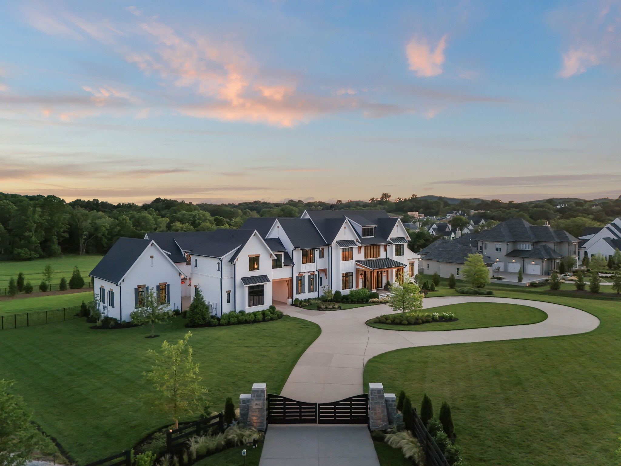 Experience small-town charm, unmatched luxury & grandeur, and picture-perfect Tennessee hillside sunsets in one special place: 1561 Sunset Road. This privately-gated, 2 acre property in prestigious Brentwood, TN, the most sought-after location in one of the nation's fastest growing cities. An award-winning Parade of Homes show home, this custom-built home has now been elevated w/ a new detached office space and a state of the art pool with water and fire features and integrated entertainment and cooking spaces overlooking stunning vistas and sunset views. As you step inside, you are greeted by a spacious, elegant interior with 6 beds, 8.5 baths, home offices, bunk room, safe room, gym, media room, wine cellar, sports den, and more! 1561 Sunset Road is the epitome of Tennessee living at its finest--down home comforts, spectacular scenery, and luxurious quality meet to deliver on the promise of a storybook lifestyle you won't find anywhere else.