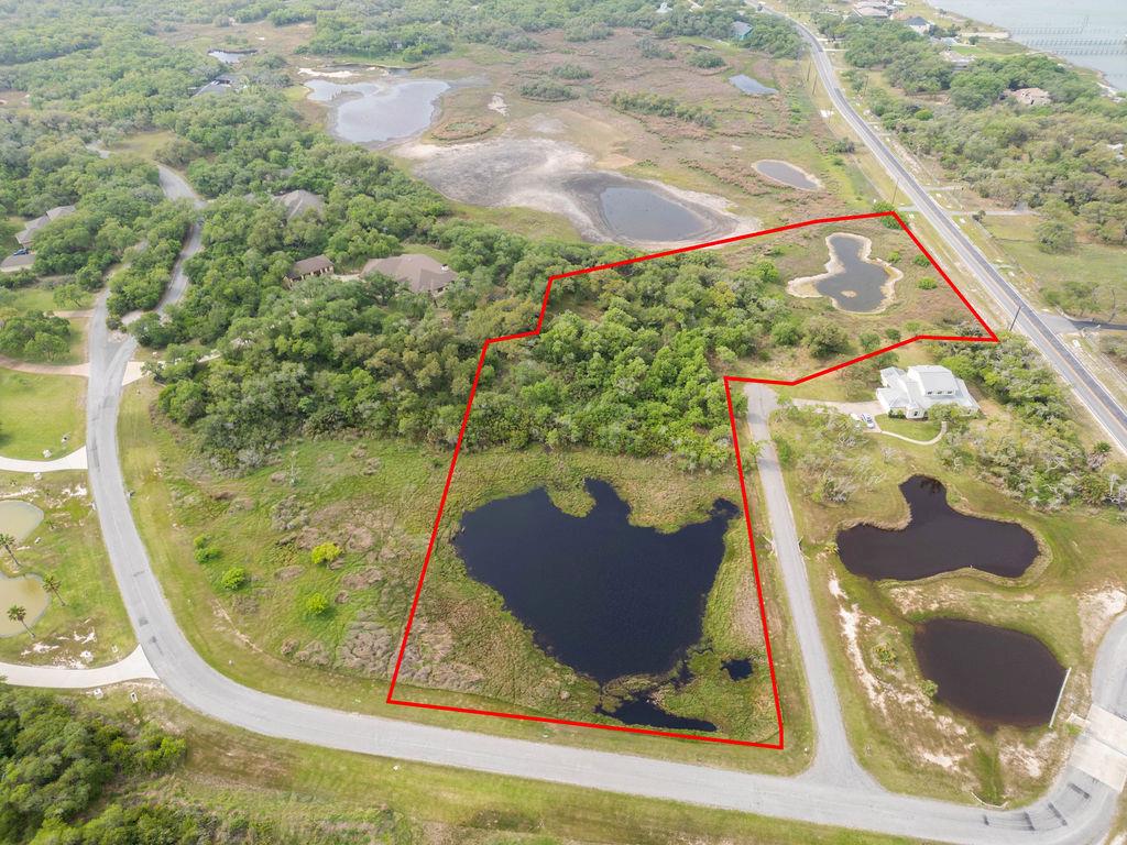 Nestled within the prestigious gated community of The Preserve in Rockport, Texas, this exceptional 5.12-acre tract of land offers an unparalleled opportunity to create a luxury estate in a truly serene setting. Fabulous native trees and lush vegetation envelop the property, creating a natural canopy of privacy and tranquility. Tucked away yet conveniently located near Rockport's finest amenities, this prime homesite promises both seclusion and sophistication. With generous space to design your dream home, gardens, and outdoor living spaces, the possibilities are as expansive as the land itself. Experience the ultimate in elegance and exclusivity—this is coastal Texas living at its most refined. This property was recently re-platted and tax valuations are estimated.