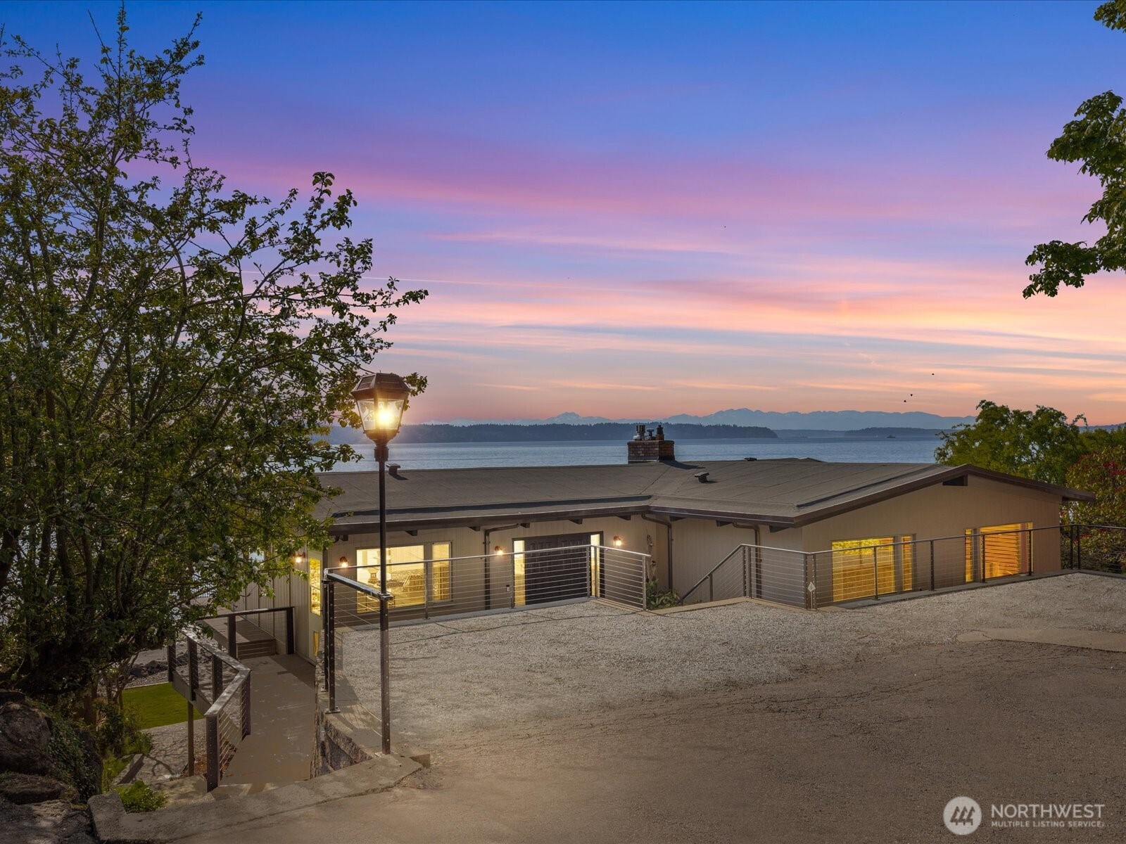 Tucked away in Seahurst, this waterfront haven offers over 180° of sweeping Puget Sound views and rare privacy on a coveted point. Unlike many homes in this area, you can drive up to your front door - no tram required. The beautifully updated kitchen features high-end appliances—double ovens, gas stove, built-in microwave—and cozy in-kitchen seating to enjoy sunrise with your coffee. Upstairs glows with refinished Red Oak floors and fresh paint, while the primary bath includes a heated mirror in the shower. Entertain on the main-level deck with front-row seats to orcas and seals. There’s room for up to five vehicles, plus generator wiring and an outdoor shower—pure Northwest coastal luxury. 4th bedroom downstairs is non-conforming.