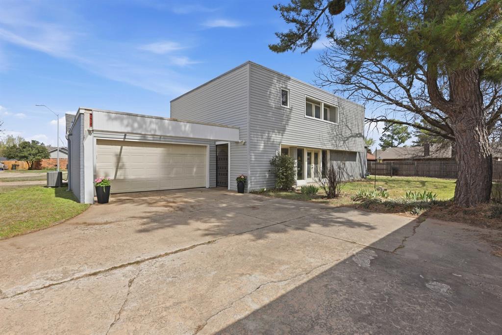 This stunning California-style modern home in West Norman is a masterclass in light and layout, featuring soaring ceilings, a signature fireplace, and dramatic floor-to-ceiling windows that bathe the entire space in natural light. The heart of the home is an updated kitchen with an abundance of cabinetry for the ultimate storage-to-style ratio, while the unique Art Deco-inspired floor plan offers two private bedroom suites separated by an incredible windowed office that serves as a sun-drenched sanctuary for remote work. Move-in ready with updated flooring and located conveniently to the 1-35 and tons of shopping. One-of-a-kind property is a must-see for anyone seeking an architecturally cool retreat that stands out from the crowd.
