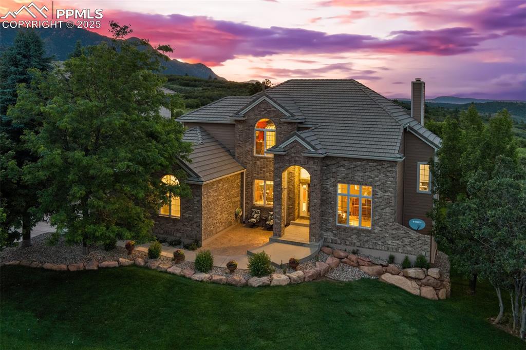 Your Dream Home Awaits! Nestled in the highly sought-after Peregrine neighborhood in NW Colorado Springs, this extraordinary 6-bedroom, 5-bath residence redefines luxury living with its sweeping mountain and city views. Spanning 4,507 square feet, the home perfectly balances elegance and functionality in one of Academy District 20’s most desirable communities.Freshly painted throughout, this home welcomes you with soaring ceilings, hardwood floors, and a dramatic staircase. The spacious dining and living rooms set the tone for gatherings, while the sun-filled family room (don’t miss the sizable hidden storage!) impresses with oversized windows, a cozy gas fireplace, and captivating views of the city, mountains and Air Force Academy. The kitchen is a true entertainer’s delight, offering stone countertops, sleek cabinetry, and an island designed for conversation and function.The floor plan shines with thoughtful touches, including a private office just off the staircase and expansive windows framing views in every direction. Upstairs, the primary suite is a retreat with breathtaking panoramas, a spa-like 5-piece en suite, and walk-in closet. A junior primary with updated bath, two additional bedrooms with a shared Jack & Jill bath, plus tasteful updates throughout elevate the home. The walk-out basement offers two more bedrooms, a full bath, and a large recreation room ready for movie nights, workouts, or hosting guests.Outside, a newer 40x20 composite deck provides the perfect vantage point for enjoying both mountain views and city lights. The lot is a rare find, backing to the AFA for maximum privacy while offering usable yard space for play, gardening, or relaxation. Additional features include updated light fixtures, central AC, security system, and oversized 3-car garage with storage.With neighborhood parks, ASD20 schools, and a prime Peregrine location, this home is more than a place to live—it’s a lifestyle. Don’t miss the chance to make it yours!