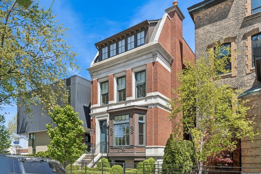 East Bucktown luxury home that includes attention to detail rarely seen today. The home sits on an oversized lot and is steps to everything the vibrant neighborhood offers; 606-Trail, Damen retail, shops, restaurants and transit, offers the next owner the perfect place to call home. The brick and limestone facade create a class curb appeal, with a copper bay window and gas-lit lamps adorn the front door. Nearly 6,000 sq. feet, includes six bedrooms, 5.1 baths, elegant main living level with detailed mill work & custom cabinetry, a chef's kitchen of magazine caliber. Three outdoor spaces include raised and heated bluestone patio off the living room, built-out garage deck and roof top deck with skyline views. Luxe brands throughout the home include WaterWorks, Toto, Nana doors, SubZero, Wolf, Asko appliances; interior design was executed by Lozano Jolas Design (formerly Skin) Four bedrooms on the second level, penthouse guest suite, plus additional bedroom in the lower level. Oversized 2.5 car garage is great for family vehicles, toys or additional storage. The home shares a semi-private alley with six other homes, gated to Cortland Street. Neighborhood amenities include the 606-Trail, Damen retail, Etta, Olivia's Market, Goddess & the Grocer, Six Corners, Robey Hotel and a transportation paradise with El-stop (Damen), Metra (Clybourn) and Kennedy expressway. Your next chapter begins here!