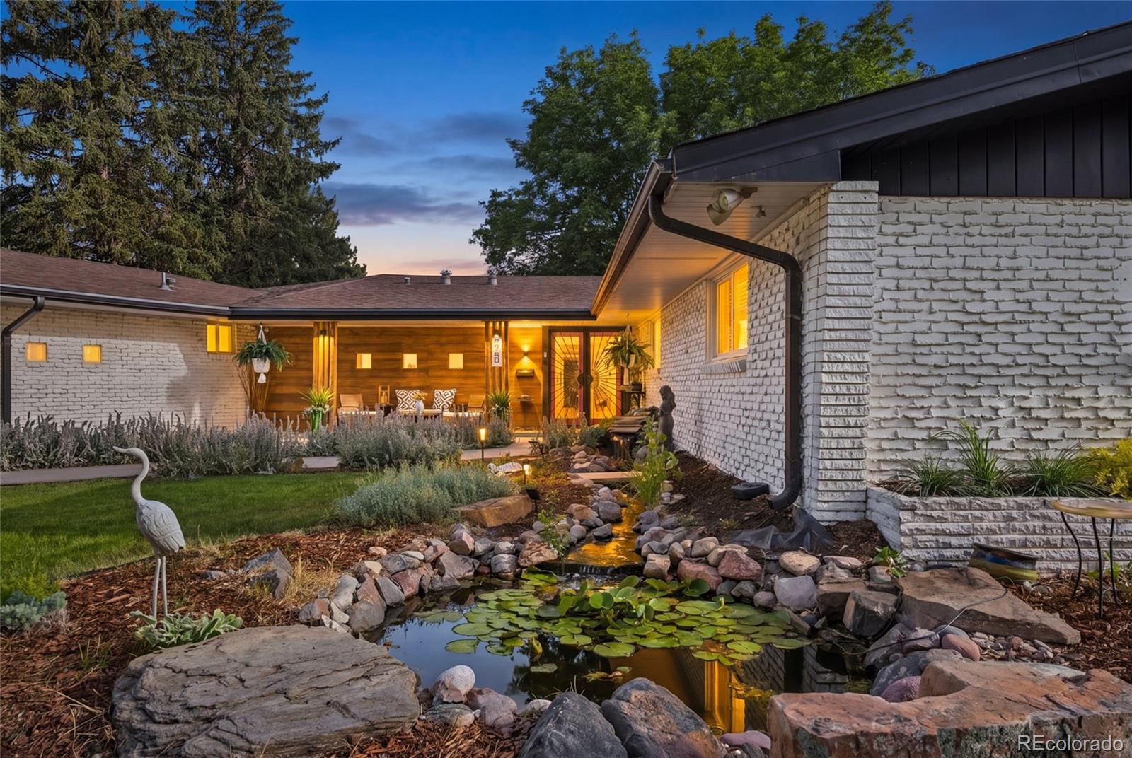 An Extraordinary Resort-Style EstateTucked away on an exquisitely landscaped **Over half acre lot** homesite in the exclusive Lakeridge community, this remarkable estate offers a rare blend of privacy, sophistication, and resort-style living just minutes from downtown Denver. Designed for those who appreciate exceptional style and effortless luxury, this residence is as impressive as it is inviting.Offered at **$1,595,000**, the home features **5 bedrooms and 6 bathrooms**, including **en-suite accommodations for every bedroom**, providing exceptional comfort and privacy for family and guests alike. Thoughtfully reimagined with meticulous attention to detail, the home showcases timeless design, expansive living spaces, custom finishes, and walls of glass that seamlessly connect the elegant interior to breathtaking outdoor living areas. The grounds are truly spectacular, featuring a **heated saltwater pool, hot tub, custom outdoor bar,** multiple entertaining spaces, mature landscaping, and peaceful gathering areas that evoke the ambiance of a private boutique resort. Whether hosting unforgettable celebrations or enjoying a quiet evening beneath the Colorado sky, every day feels like a vacation. A beautifully appointed detached **Pool House** offers exceptional flexibility as a guest retreat, private office, fitness studio, or creative space.Additional amenities include **RV parking with full hookups**, abundant storage, and an extensive list of thoughtful upgrades. Ownership also provides the opportunity for **exclusive membership to the Lakeridge Association at Wolcott Lake** (approximately **$1,000 annually**) Voluntary** offering private lake access, a playground, brand-new pickleball courts, scenic walking paths, and exclusive use of the lakeside pavilion for private gatherings.Rarely does a property of this caliber become available. More than a home, this is a private estate offering an extraordinary lifestyle for the discerning buyer