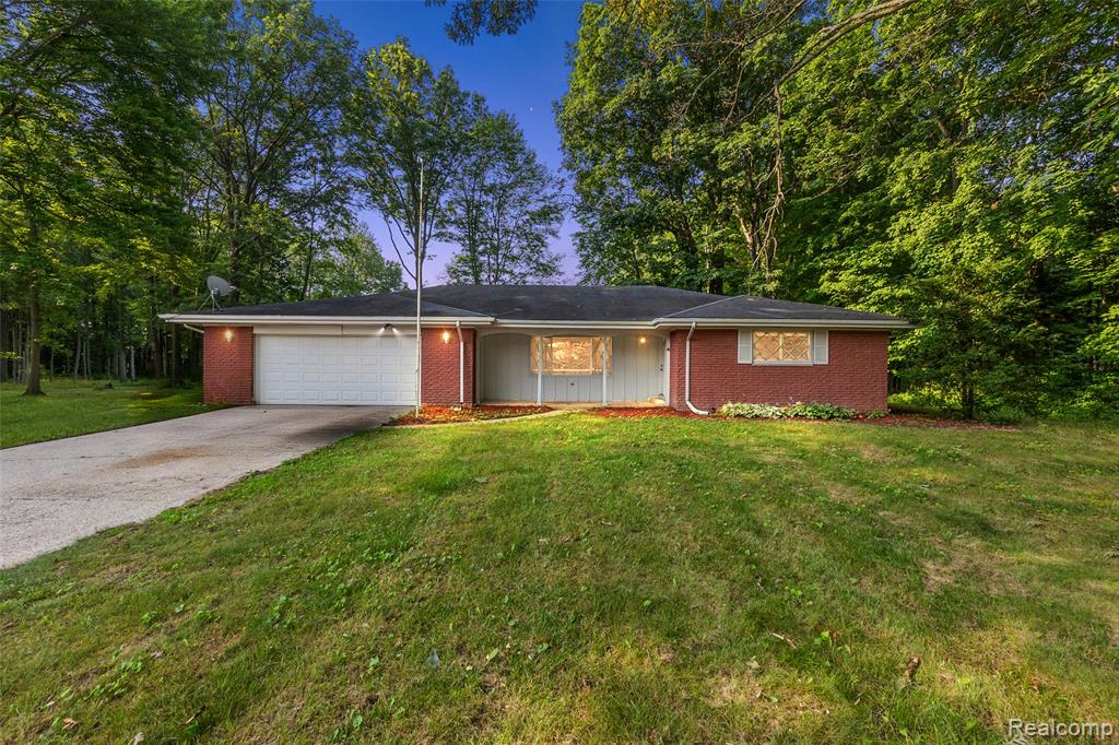 Welcome to your private 33+ acre retreat in Swan Creek Township! This sprawling 3-bedroom, 2-bath brick ranch offers over 3,400 sq ft of finished living space, including a partially finished basement and cozy three-season room. The home showcases an updated kitchen with generous dining space, two full baths, and large windows providing serene views of your land.

Outdoors, you'll find everything you need for work and play: a 54x64 heated outbuilding complete with bathroom, on-demand water heater, and laundry, plus a 20x50 pole barn ideal for storage or hobbies. The property also features a unique 11-acre pond with a beach area, multiple docks, a gazebo, and wooded acreage perfect for trail riding, hunting, or simply enjoying nature.

Additional highlights include a 2.5-car attached garage, motocross track, and public water. Whether you're looking for a hobby farm, recreational property, or a peaceful homestead, this property offers it all—schedule your private tour today!