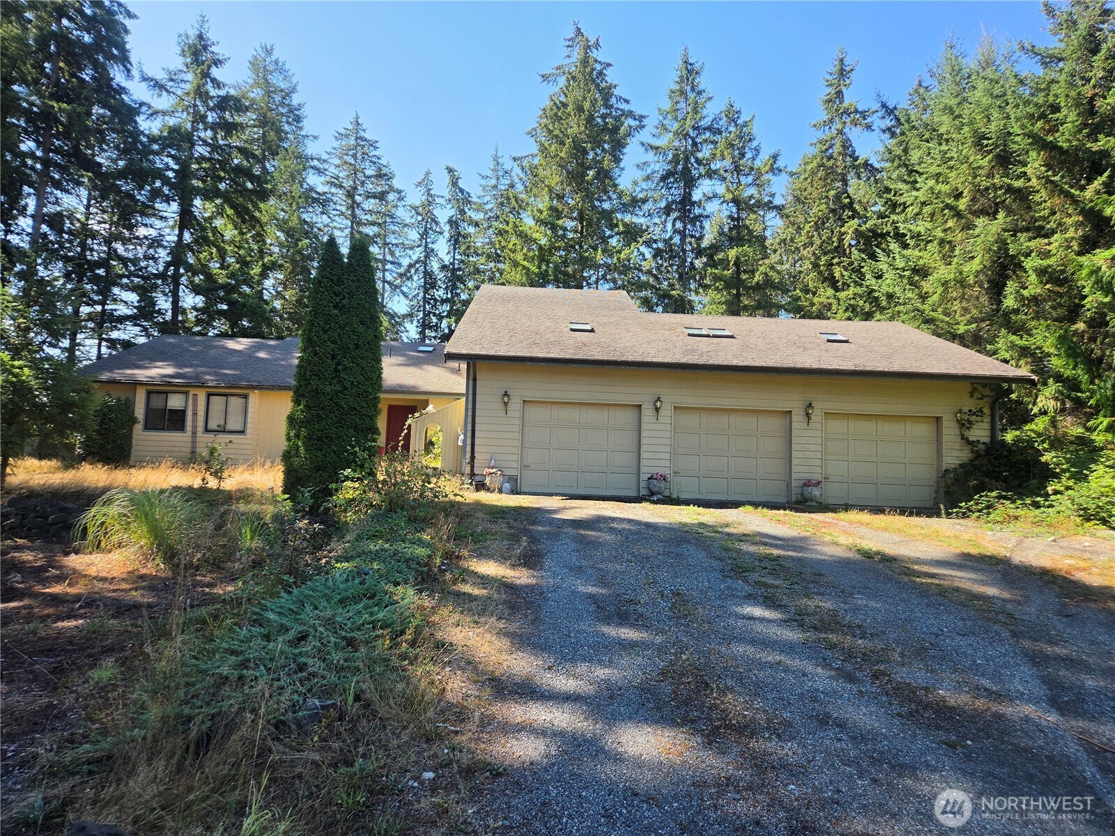 This custom built gem on a 1 acre lot, with a some updating, repairs, and polish will turn into a diamond! Great, open and bright floor plan with large rooms, vaulted ceilings, and lots of skylights. All 1990's original. Oak hardwood flooring in the entry and family room. Large primary bedroom with 3 separate closets and a bath with a huge walk in shower. Impressive attached garage with room for 5 cars if parked in tandem, or 3 cars with a large shop area. Gas heat and hot water, and a free standing gas stove in the family/ kitchen area. Delightful Sun room with duel access from the living room and family room, and a a sky wall with lots of glass to enjoy the private backyard setting. The large outside deck has a gas valve for a barbeque, but is in bad shape and needs to be replaced. The kitchen has oak cabinets, eating nook, bar, and a huge walk in pantry. The spacious utility room has many built in cabinets and has 2 separate doors to access the different sides of the garage. Chain link fencing with an access gate to the side yard off of Waller Road. This is a rare find!