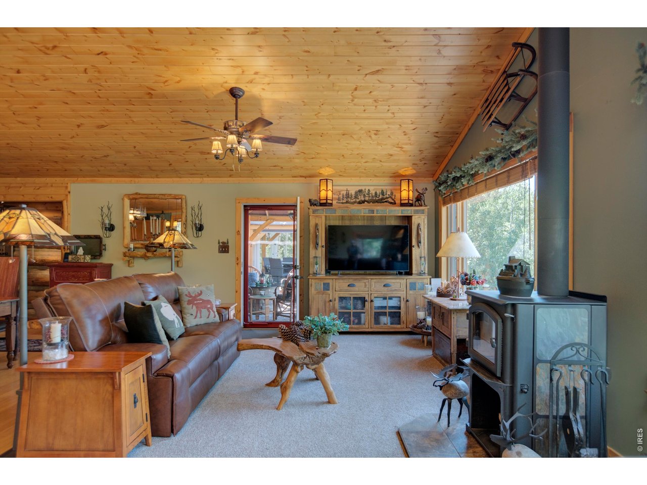 Storm Mountain Basecamp offers the Colorado mountain lifestyle buyers are looking for, with 3.5 wooded acres adjoining USDA Forest Service land near Drake, Colorado. Set at approximately 8,700 feet among mature pine, fir, aspen and natural rock outcroppings, the property combines privacy, recreation and usable improvements in a setting that feels far larger than its deeded acreage.The 2,174-square-foot, 3-bedroom, 2-bath cabin has the character a mountain property should, with warm wood finishes, a wood stove, propane forced-air heat and inviting indoor-outdoor living. A wraparound porch and multiple outdoor seating areas provide room to relax beneath the trees and enjoy the cool mountain setting.A 24x36 pull-through shop with 10-foot doors provides excellent space for vehicles, UTVs, tools, hunting and fishing gear, and mountain toys. Additional improvements include a 900-foot private well, septic system and professionally installed solar system capable of powering the property.Recreation is at the heart of Storm Mountain Basecamp. The property borders public land, with an extensive trail system approximately one mile away for hiking, horseback riding, mountain biking and ATV/OHV use. Located in GMU 20, the surrounding country offers hunting and abundant wildlife, while the Big Thompson River, Lake Estes and nearby mountain waters provide excellent fishing opportunities. Estes Park, Rocky Mountain National Park and Loveland are all within convenient reach.This is more than a mountain cabin. It is a comfortable, well-equipped basecamp for exploring some of Northern Colorado's best public land and recreation, with the shop, acreage and infrastructure to make year-round mountain living practical.