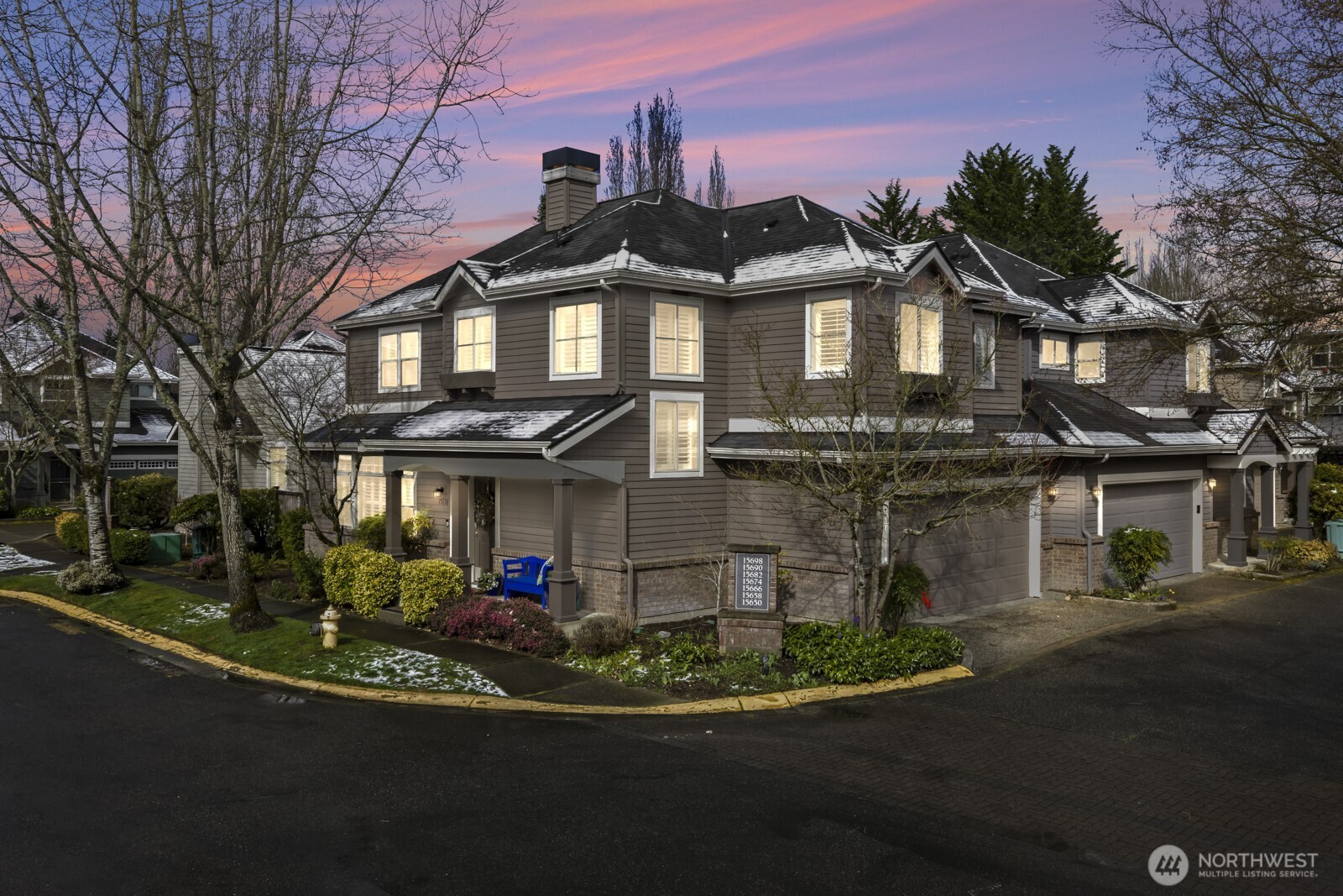 Sought after Windwood Village at Bella Bottega! This detached townhome lives like a single-family home—without the exterior maintenance—walk to shops, restaurants the movie theater and just steps to the Sammamish River Trail. Offering 1,866* sq ft, this home features 3 bedrooms plus a flexible bonus space ideal for a home office and/or media room. A charming Craftsman exterior and covered front porch create a warm welcome. Inside, the tiled foyer opens to a bright great room with engineered hardwood floors, ceiling fan, cozy gas fireplace, transom and shuttered windows. The open layout flows into the dining area and kitchen with slab granite counters, warm wood cabinetry, tiled full height backsplash, breakfast bar, pantry and stainless steel appliances including a new dishwasher, recessed refrigerator and gas range/oven. Sliding doors off the kitchen lead to a private backyard patio, perfect for morning coffee or afternoon respite. Upstairs includes three bedrooms, two updated baths, and a bonus/flex space. The vaulted primary suite offers a ceiling fan and an updated five-piece bath with soaking tub, tiled shower, 12x24 tile floors, and dual vanities with floating vessel sinks. 2 additional bedrooms—one with a queen sized Murphy bed—share a full bath also updated with new lighting and vessel sink. Highlights include: new furnace (2024), 2-car garage with overhead storage, 9-ft ceilings, white shutters on all windows and engineered hardwood floors throughout. Pre-inspected!