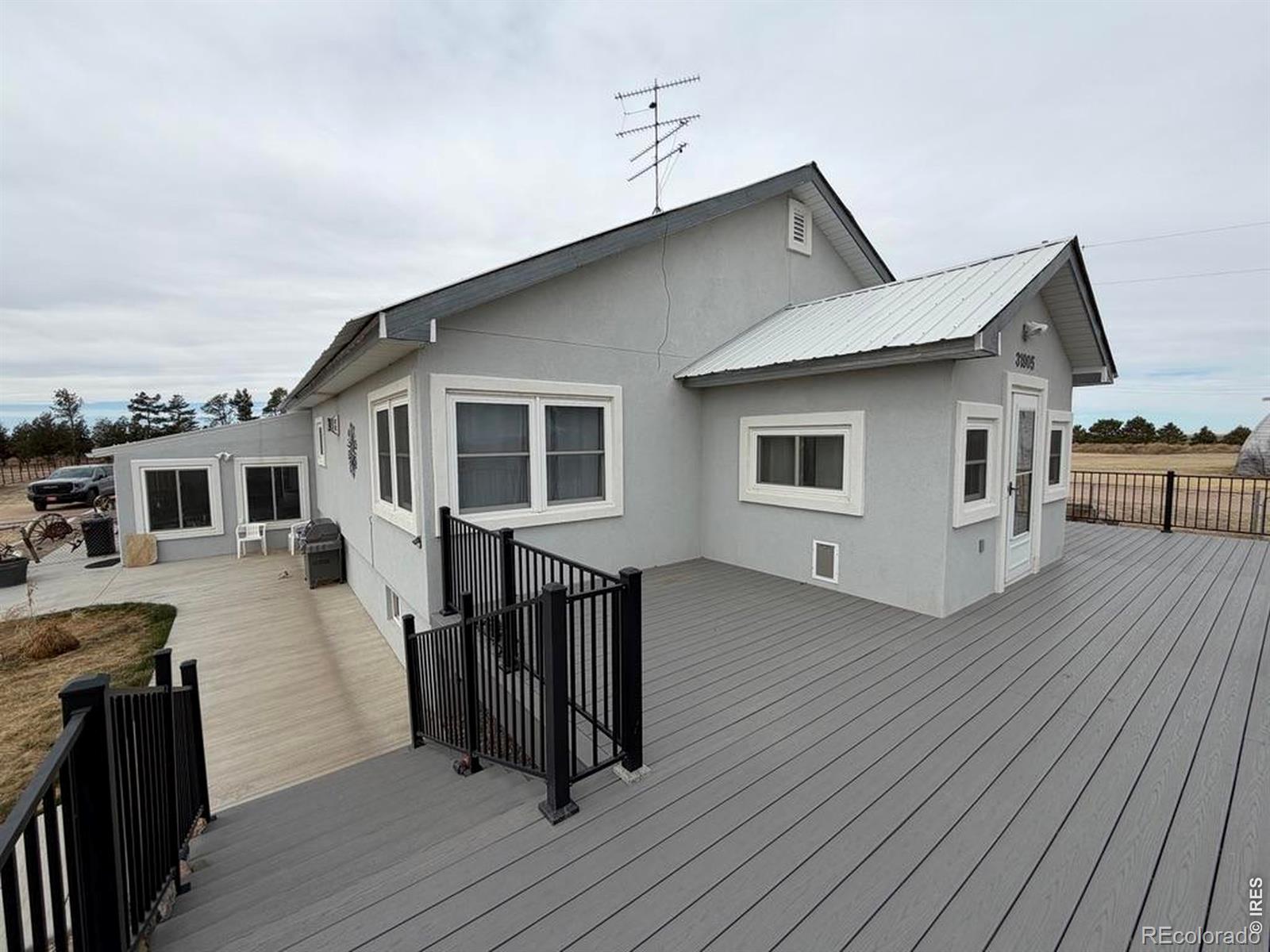 Remodeled Home on 35 Acres 96 GPM Well 984 SF Sunroom Shop, Barn & Corrals31905 County Road 4 - Flagler, ColoradoLocated just outside Flagler, Colorado, this beautifully improved 35-acre country property offers the perfect combination of a fully remodeled home, productive pasture, and functional livestock improvements.The 3-bedroom, 2-bath home features 2,160 square feet of living space (per assessor) and has been completely remodeled from the studs out, including new electrical, plumbing, furnace, hot water heater, windows, and exterior stucco. The home features hardwood floors through much of the living area, a gas fireplace, and a large east-facing porch ideal for enjoying quiet country mornings and expansive High Plains views.One of the standout features is the large 984 square foot enclosed sunroom in addition to finished area, complete with new windows and a mini-split system providing both heating and cooling, creating an exceptional year-round living or entertaining space. The property is well-equipped for livestock or a hobby farm, with heavy-duty metal-pannel corrals, a barn with electricity, and approximately 20 acres of fenced pasture, along with additional open ground. A 40' x 60' Quonset building with electricity provides excellent space for equipment storage, shop use, or hay storage. Water is a major highlight of the property. The registered well features a new pump, tank, and casing and was tested in 2022, producing approximately 96 gallons per minute at 36 PSI, providing ample water for residential use, livestock, and property improvements. Water lines run from the well house to a stock tank and serve additional areas of the property. Additional improvements include:22 kW Generac automatic backup generator, New septic system installed in 2021Approximately 1,400 sq. ft. of concrete walkways and patio areasLandscaped yard with 4-foot chain-link fenceGarage improvements with updated door and keypad entry, Fiber optic internet