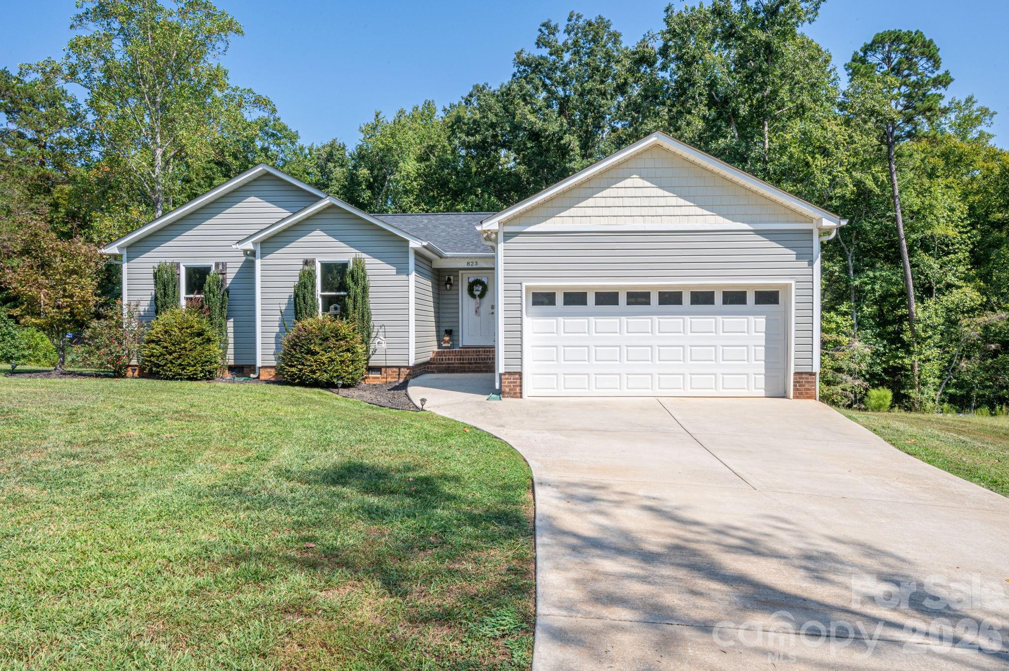 Welcome Home to Peaceful Living in Dallas!If you’ve been searching for a peaceful retreat away from the hustle and bustle, yet still want the convenience of a short commute, look no further! This beautifully maintained 2020-built home sits on nearly half an acre in the desirable Dallas area and offers plenty of space, privacy, and modern comfort.Step inside to a bright and inviting open-concept floor plan that seamlessly connects the kitchen, dining area, and living room—perfect for everyday living and entertaining. The well-appointed kitchen features granite countertops, a breakfast bar with seating for multiple guests, and a full suite of stainless steel appliances.Beautiful weathered-gray LVP flooring flows throughout the home, complemented by tasteful neutral finishes and a warm, welcoming atmosphere. The spacious primary suite offers plenty of room for a large king-size bedroom set and features a generous walk-in closet and a beautifully designed en-suite bathroom.Two additional bedrooms provide ample space for family, guests, a home office, or hobbies, while maintaining the home’s clean and modern farmhouse aesthetic.Step outside and discover one of the home’s standout features—a large, fully fenced backyard with plenty of room to relax, play, garden, or entertain. The expansive deck overlooks the backyard and creates the perfect setting for morning coffee, weekend gatherings, or relaxing evenings outdoors.Built in 2020, this home offers the peace of mind that comes with newer construction while providing the space and privacy of a larger lot. If you’re looking for the best of both worlds—peaceful, spacious living with convenient access to everything you need—this home deserves a closer look!Come see why this could be the home you’ve been waiting for!