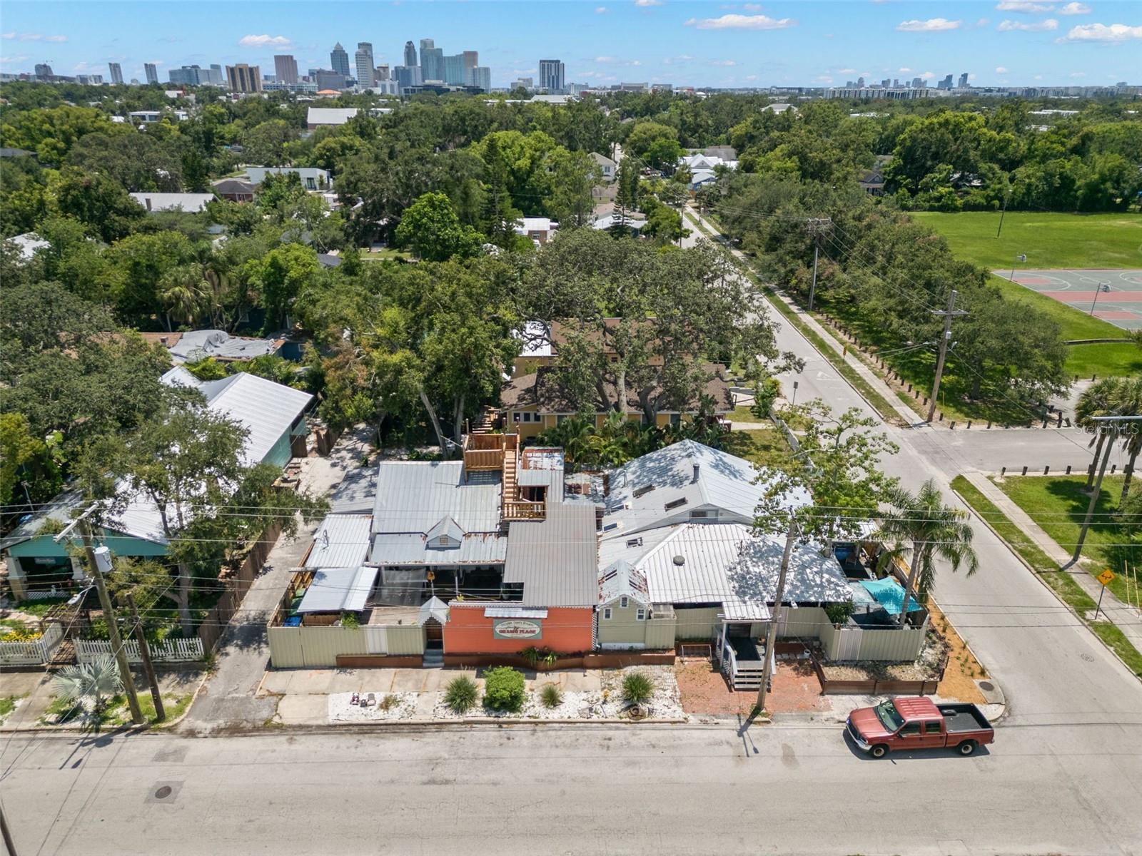 This is Your Opportunity to Own a Piece of History!Income Producing B&B/ HOSTELGram's Place Bed and Hostel is Tampa's oldest Hostel. Gram's Place Bed and Hostel features 6 completely private rooms with ensuite baths, 6 traditional shared dorm rooms with shared baths, 2 'Semi-Private” Rooms which are still private, but without an ensuite bath, and multiple common areas as well as an outdoor ½ bath and shower. All rooms are air conditioned, and the property has full internet, in this music-themed hostel.Two full kitchens are available to all of the guests to prepare one’s own or communal meals ,with cookware, plates, and silverware. The compound features a heated jacuzzi /spa patio deck, open seating and quiet areas with deck chairs, two countertops and stools for guests to use, a stage for music performances and concerts, and a full laundry staff and laundry services for guests. The whole property is fenced with a secure NEW fence and coded locks on all the doors and entries for additional security and control of access. Guest have long enjoyed our “Stairway to Heaven” pathway that ascends and through the tree canopy to the rooftop platform in the trees that guests have affectionately named “The Crow’s Nest”. This quiet neighborhood of Tampa Heights neighborhood is the fastest growing area in the Tampa Bay area. “Plymouth Playground” neighborhood park is across the street and features basketball courts, a picnic-ready green lawn, a baseball park, and a children’s playground for everyone’s use and enjoyment.The family-run Bed and Hostel, in continuous operation since founded in 1991, has been a long-time destination for world travelers, businesspeople, and folks from every walk of life. are all welcome and cater to Business Professionals, Couples, Members of the LGBTQ community, Families with children, Artists, Musicians, Singers, Songwriters, Actors, Painters, and Poets, etc. from all corners of the world. This property is located:1 mile north of downtown Tampa./  1/2 mile to Armature work and Straz Performing Arts Center/ 1.25 mile from University of Tampa / 1 .5 miles to Historic Ybor City/ 2 Miles to Downtown Riverwalk and Bayshore Blvd. / 5 miles to Busch Gardens /2.5 miles to Raymond James StadiumRiverside Heights is an easy commute to all areas of Tampa and close to bridges to St Petersburg, Clearwater and Gulf Beaches. This hostel/hotel is a profit maker and has the potential for upcharges and additional income possibilities.Gram’s Place Bed and Hostel is named in honor of Singer/Songwriter Gram Parsons (1946-1973).