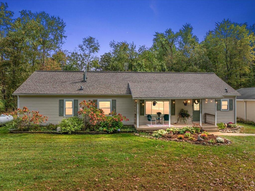 This beautifully updated ranch home sits on over 7 acres of land.  It has the best of everything; privacy, wildlife, and Northern Michigan vibes! A well thought out floor plan that feels spacious yet cozy. The primary bedroom and fully updated en-suite are situated on one end of the home for ultimate privacy and the two additional bedrooms are at the other end of the home with a shared, updated bathroom.  Enjoy the gorgeous updated kitchen that is positioned in between the spacious dining room and the breakfast nook, perfect for entertaining large groups. You will love relaxing on the screened in porch where you can watch wildlife and truly immerse yourself in the calmness of your property and country living. The pole barn is perfect for car enthusiasts, fisherman, or gardeners. There is tons of space for storage and it also has concrete flooring, and 100 AMP fuse box! Some of the other notable features include but are not limited to: updated flooring, lighting fixtures, fresh paintthroughout, and newer appliances. The neighboring property is also available for purchase that would then make this over 10 acres! This amazing home and property wont last long, schedule your tour today!