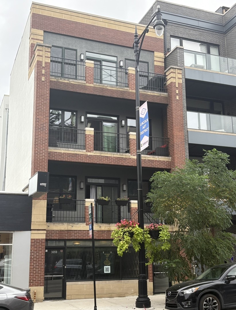 Exquisitely Updated Condo in Lakeview with Garage Parking and EV Charging    Discover unparalleled urban living in this beautifully updated and extra-wide 2-bedroom, 2-bathroom unit in a quiet, owner-occupied 4-unit building in Lakeview. Situated in an unbeatable location near the Southport Corridor and Roscoe Village, this condo perfectly blends modern amenities with a vibrant neighborhood lifestyle.    The home has been meticulously renovated with high-end features, offering comfort and style at every turn:    Contemporary Upgrades: Experience a virtually new home with brand new bathrooms built in 2025 and all new energy-efficient windows and a sliding glass door installed in 2023.    Stylish Living Room: The huge living and dining area is anchored by a cozy fireplace, and features custom built-in shelving and a dry bar, perfect for entertaining.    Outdoor Space: Enjoy summer nights and grilling on your large, covered front balcony.    Expertly Maintained Building: Peace of mind is ensured by recent building improvements, including professional tuck-pointing in 2023.    Generous Parking: A rare find in the city, this unit includes two parking spaces: a dedicated 1-car garage and an additional parking pad for a second vehicle.    Electric Vehicle Ready: The garage is equipped with an electric vehicle charging station, combining modern sustainability with ultimate convenience.    This condo is an exceptional opportunity to enjoy a turn-key home in a highly sought-after urban location.