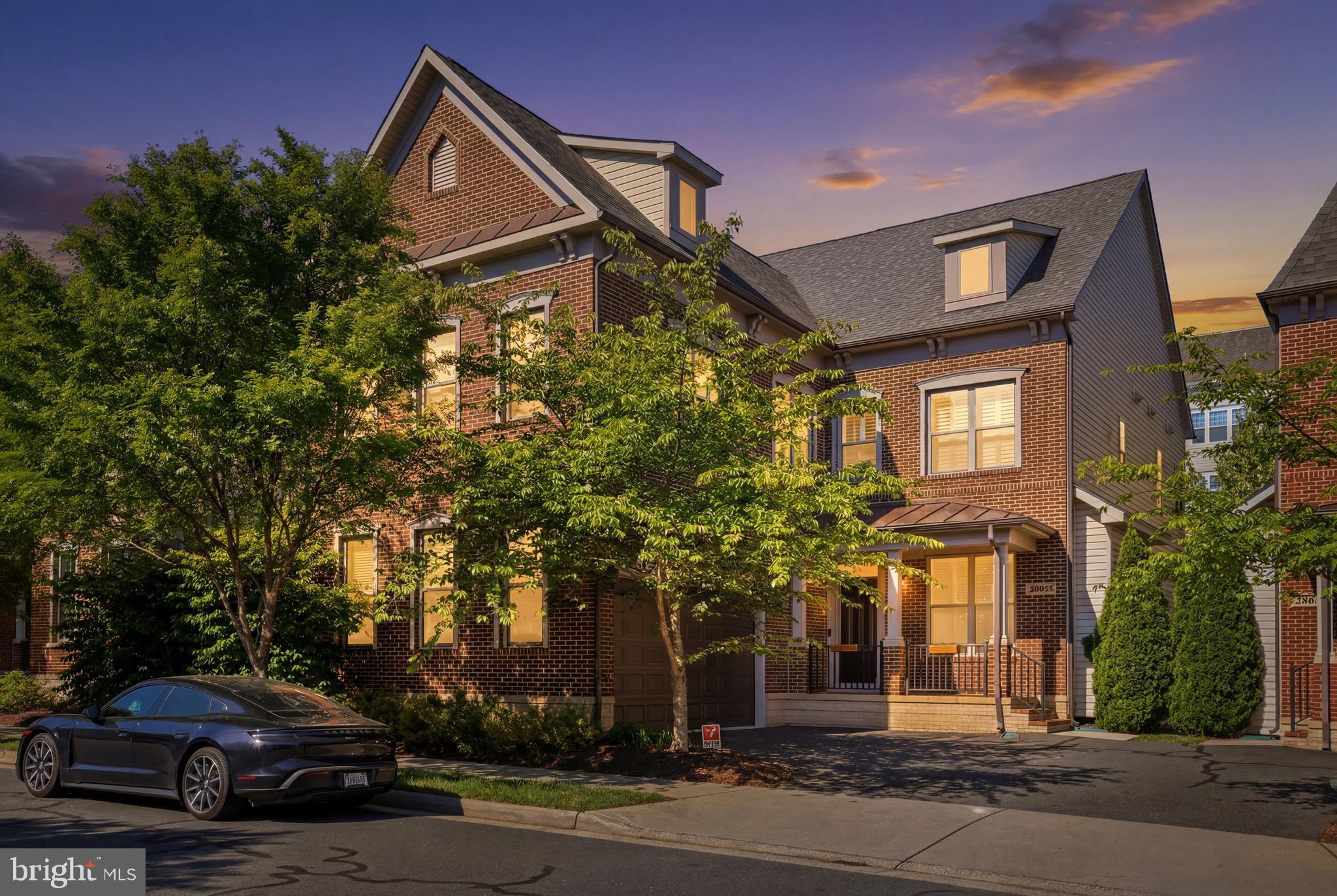 Welcome to 20623 Holyoke Drive — a beautifully upgraded residence offering over 5,500 square feet of thoughtfully designed living across three finished levels in one of Loudoun County’s most sought-after communities. With 6 bedrooms, 4.5 bathrooms, dedicated office space, a private gym, and a fully finished lower level complete with its own kitchen, this home was designed to deliver both everyday functionality and elevated living at scale — all while being moments from the unmatched lifestyle of One Loudoun.From the moment you enter, the home makes an immediate impression with engineered hardwood flooring flowing throughout the main and upper levels, custom crown molding, and a layout that balances open-concept gathering spaces with intentional design details throughout. The main level features multiple living and entertaining areas, including a custom-built library and reading room that adds warmth, character, and versatility to the home.The kitchen serves as the centerpiece of the main level, finished with white cabinetry, white quartz countertops, a Wolf gas cooktop, and Bosch dishwasher, all opening naturally into the home’s central living spaces. A custom mudroom built-in off the garage entrance adds both convenience and organization to everyday living.Upstairs, the expansive primary suite offers a true retreat with hardwood flooring, separate his-and-hers closets, and a custom-built organization system within the hers closet. An added office/den upstairs creates the ideal setup for working from home, studying, or a private lounge space away from the main living areas.The fully finished lower level significantly expands the home’s flexibility, featuring an additional bedroom and full bathroom, a dedicated gym space, and a secondary kitchen complete with gray cabinetry, black granite countertops, and full appliances — ideal for extended stays, multigenerational living, entertaining, or recreation.One of the home’s standout features is the outdoor space — a rare offering within the neighborhood. Unlike many nearby cluster homes that back directly into neighboring properties or streets, this section of Holyoke Drive offers a true backyard experience with usable green space beyond the custom-built deck and patio, creating the perfect setting for entertaining, relaxing, or enjoying outdoor living with added privacy and openness.Additional highlights include window shutters throughout the main level and upstairs hallways, tiled basement flooring, a Kenmore washer and dryer, and a newly replaced water heater installed in 2025.Beyond the home itself, residents enjoy access to an exceptional amenity-rich community featuring a resort-style pool, tennis courts, playgrounds, walking trails, volleyball courts, and beautifully maintained green spaces designed for an active and connected lifestyle.Location is everything — and this home places you just minutes from One Loudoun, one of Northern Virginia’s premier lifestyle destinations. From upscale dining and rooftop restaurants to Trader Joe’s, Lululemon, Barnes & Noble, fitness studios, coffee shops, entertainment, and year-round community events, One Loudoun offers the kind of live-work-play environment that continues to define modern Loudoun County living. The area also offers convenient access to major commuter routes, Dulles International Airport, and the expanding Silver Line corridor.A rare combination of size, upgrades, flexibility, outdoor space, and premier location — 20623 Holyoke Drive delivers the complete lifestyle package in one of Northern Virginia’s most desirable communities.Join us for our Catered and Live DJ Open House Tuesday May 26th from 4-7pm!
