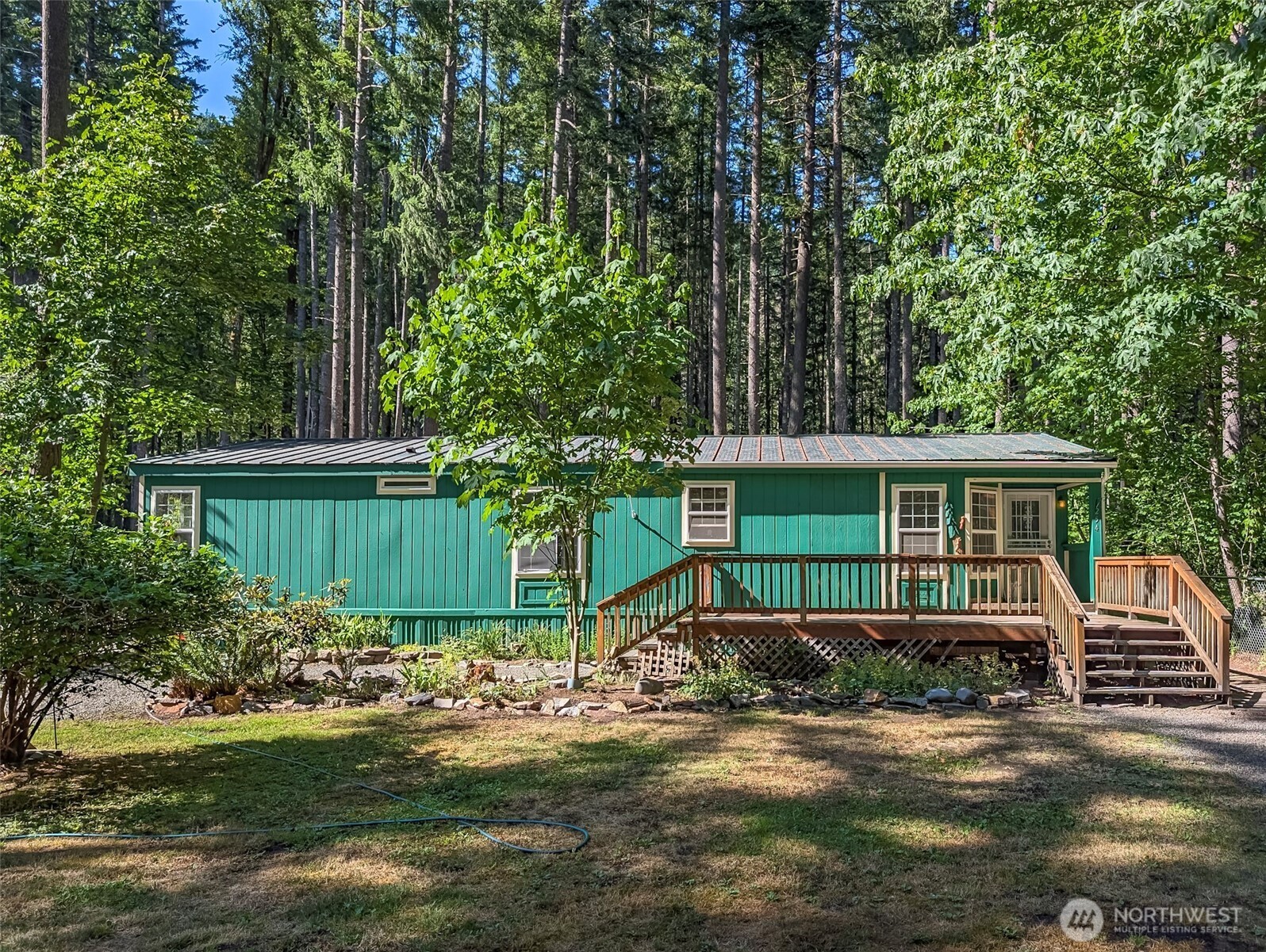 Private entrance to Gifford Pinchot National Forest! This charming 3-bed, 2-bath home that backs up to the forest has been revitalized with fresh paint and more, offering a welcoming atmosphere. Enjoy the covered decks that allow you to savor the beauty of the Northwest in all seasons. The fully fenced yard ensures privacy, while the 12x16 outdoor storage shed provides ample space for your gear. Situated on a generous High Valley parcel, you'll enjoy HOA amenities including pools, a 9-hole golf course, and a clubhouse. With Mount Rainier National Park and White Pass Ski Area just a short drive away, plus easy access to forest and river trails, this property offers all the Northwest goodness you crave!