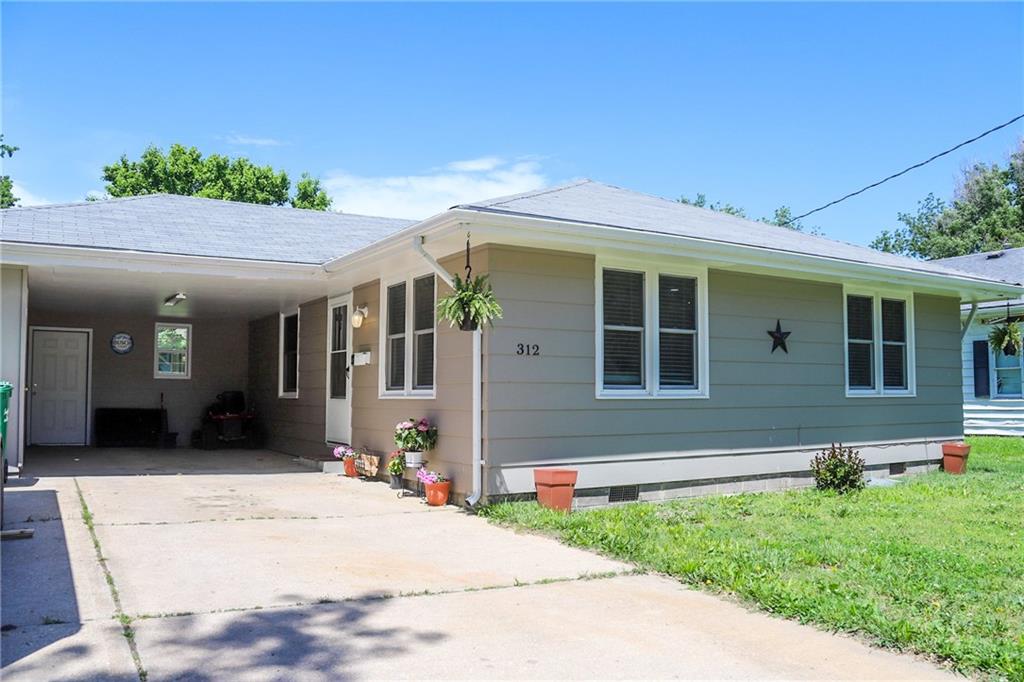 USDA and 0-1% down payment options available on this beauty! Sellers also offering a one year home warranty for new homeowner's peace of mind. Schedule a tour to see this well-cared-for 3-bedroom, 1.5-bath home with modern updates and plenty of outdoor space. Thoughtfully updated in 2023, you'll appreciate the fresh windows, interior and exterior paint, updated light fixtures, some improved flooring, stainless steel refrigerator (to convey) and dishwasher—all ready for you to move in and enjoy. Inside, you’ll find a practical open layout with warm, welcoming spaces and large inviting kitchen. Outside, the large yard offers room to garden, play, or simply relax. Conveniently located near the elementary school, downtown, park, restaurants, and with easy access to I-49, this home gives you a peaceful setting without feeling too far from the essentials.