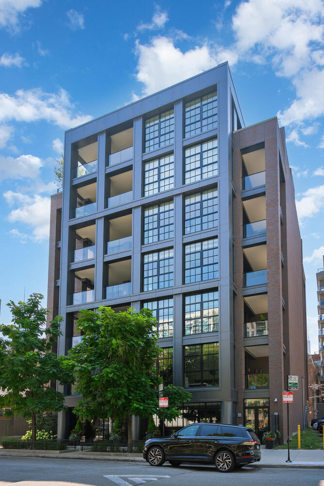 This SoHo inspired full floor home has been perfectly curated by its interior designer owner. With direct elevator access into 4500 square feet of single level living, plus 1500 square feet of covered, landscaped outdoor living, this is single family style living in the best River North location. Direct elevator access into the gracious foyer invites you into the amazingly sunny living space surrounded by floor to ceiling loft style windows with views for days. With wide open living spaces, this better than new home was designed with entertaining in mind and flexible spaces. The kitchen is a chef's dream with top end appliances including Miele, Wolf, and Subzero, an oversized island with seating to accommodate the entire family, a beautiful Ann Sacks backsplash, and designer lighting. A separate catering space/butler pantry offers incredible tucked away storage with additional beverage refrigeration and a prep sink. The marble wet bar located off the living and dining room makes hosting a breeze with additional refrigeration and storage. A large great room off the kitchen is the perfect spot for informal gathering or a perfect play space. The south wing of the home features three spacious bedroom suites, all that have been fabulously finished and designed. A thoughtfully designed laundry room can also be found off the bedroom wing with side-by-side washer and dryer, built-in ironing board, quartz countertops and a sink. The expansive and luxurious primary suite is located in the northwest corner of the home and offers a coffee bar, sensational windows, and a private terrace - a true retreat. A fabulously finished closet/dressing room and a serene bath with heated floors, dual vanities plus a makeup vanity, and a separate tub and shower.  The professionally designed and landscaped wrap around terrace is an extension of your living space with porcelain pavers, incredible city views, outdoor speakers, plus direct gas line for the firepit and grill. Additional upgrades include a whole house Sonos system and automated lighting and window treatments. Perfectly designed and finished for the most sophisticated city dweller, this home offers an opportunity for chic city living in a happening locale - plus attached garage parking for two cars! Step right outside of your front door to iconic city dining, the river, or an easy stroll to the Gold Coast.