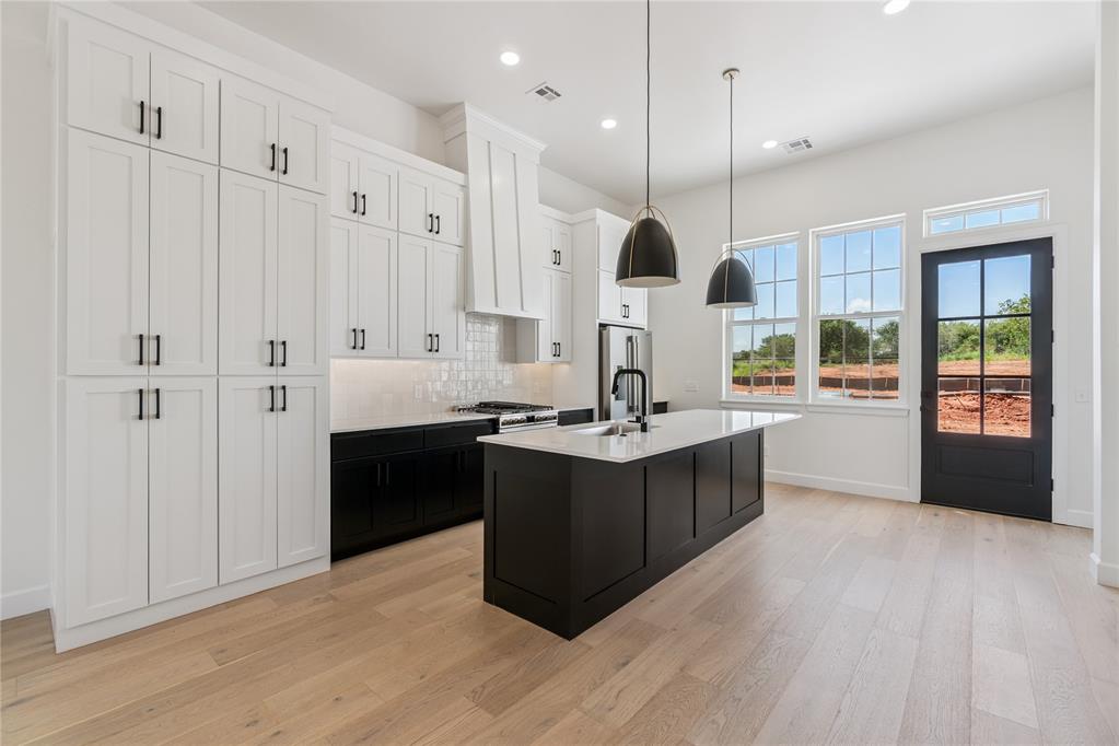Welcome to The White Workroom, a 2-bedroom, 2.5-bath townhome designed for those who appreciate clean lines, open spaces, and a refined aesthetic. This elegant retreat combines modern simplicity with timeless sophistication, creating a bright and inviting living space. The open living area and kitchen overlook the vibrant main street of Selah's Entry District, featuring a sleek design palette of soft neutrals, rich textures, and thoughtfully crafted details for a polished yet comfortable ambiance. With over half of Selah's 540 acres preserved as natural wilderness and walkable spaces, this townhome offers the perfect blend of tranquility, style, and community connection.