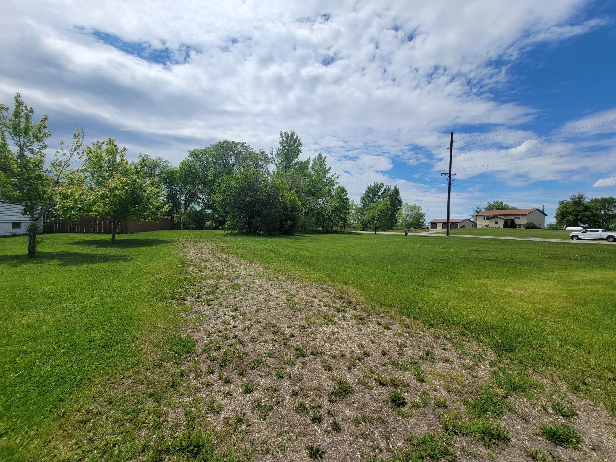 This residential-zoned lot is ideally located just off Highway 59 in Ogema, MN, offering the perfect blend of small-town charm and convenience. Situated next to a high-traffic commercial corridor and directly across from the school, the property provides a unique opportunity to build a single-family home, duplex, or other residential structure in a growing area. With easy access to nearby amenities and daily exposure to over 4,900 passing vehicles, it’s a great option for those seeking a quiet place to live with excellent proximity to community resources, or for an investor looking to add quality housing to the area. This lot to be sold with adjacent lot MLS#   which is zoned commercial.
Agent related to owner.