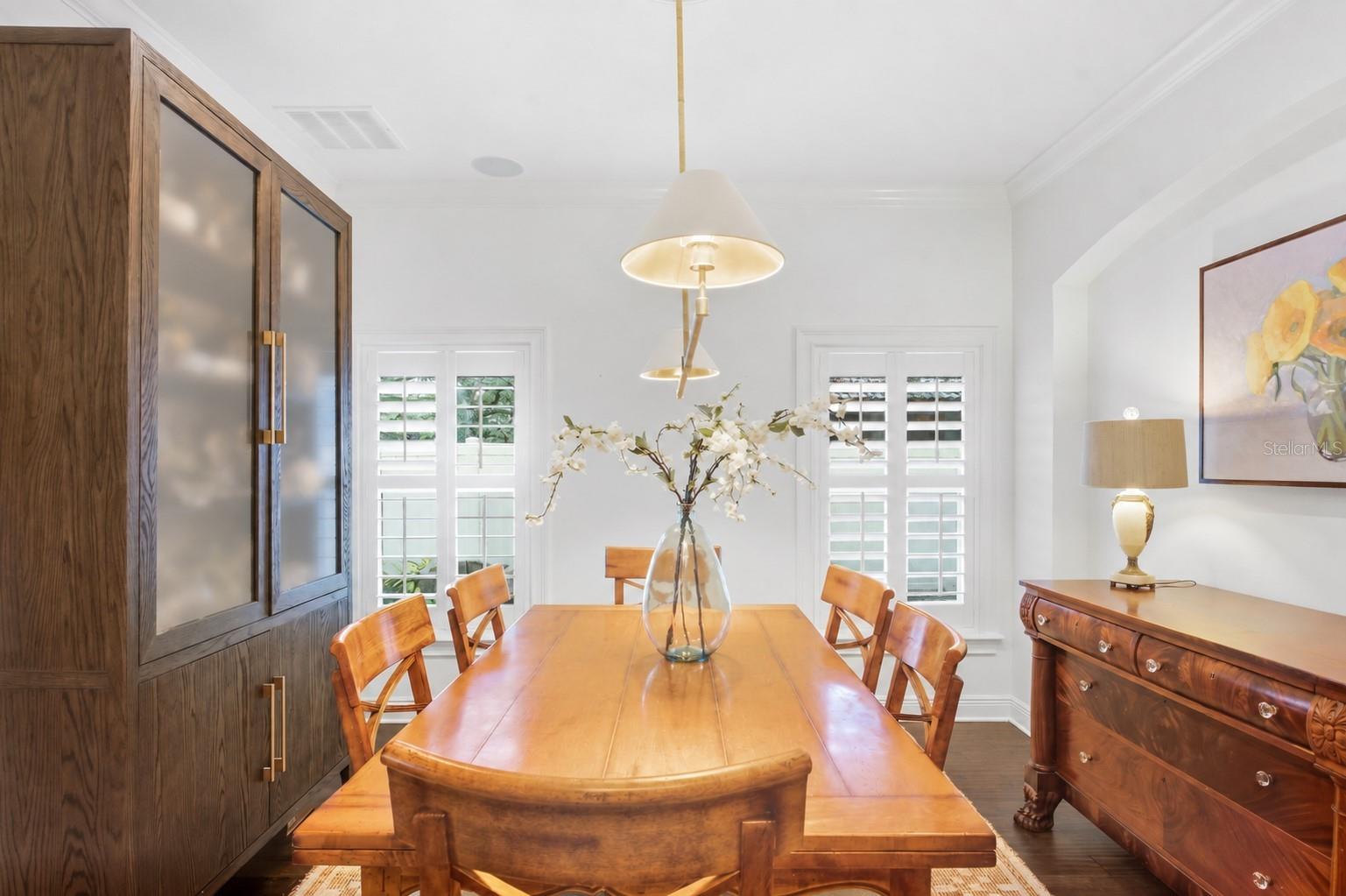 Located in the highly sought-after Plant High School District, this beautifully updated 5-bedroom, 3.5-bathroom pool home offers a spacious, functional layout designed for both everyday living and effortless entertaining. Engineered hardwood flooring flows throughout the home, creating a warm and cohesive feel from room to room. At the heart of the home is the beautifully appointed kitchen, where an oversized island with generous seating creates a natural gathering place for family and friends. A gas range, abundant cabinetry, and ample prep space make the kitchen equally suited for casual weeknight dinners and hosting a crowd. The main floor offers exceptional flexibility with a secondary bedroom and full bathroom—ideal for guests, a home office, or multigenerational living. Thoughtfully designed with direct access from the outdoor living area, the bathroom also serves as a convenient pool bath. A separate powder room completes the main level. Outside, the home is made for enjoying the Florida lifestyle. The screened-in outdoor living area features a heated saltwater pool and covered lanai, creating a comfortable setting for year-round entertaining, outdoor dining, and relaxing by the pool. Beyond the screened enclosure, additional yard space provides plenty of room to play, garden, or simply enjoy the outdoors. With five bedrooms, a versatile floor plan, updated finishes, and an inviting pool and backyard, this home offers the space and functionality buyers are looking for—all in one of South Tampa’s most desirable school districts. A close walk to the South Tampa YMCA, the Palma Ceia Little League fields, and the iconic Bayshore Boulevard!